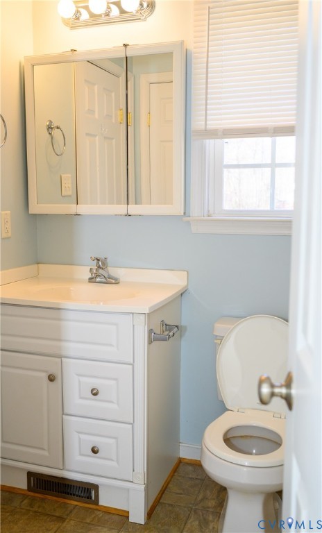 2143 Mountain View Road Powhatan, VA 23139 - Photo 14 of 34 a bathroom with a sink a toilet and a mirror