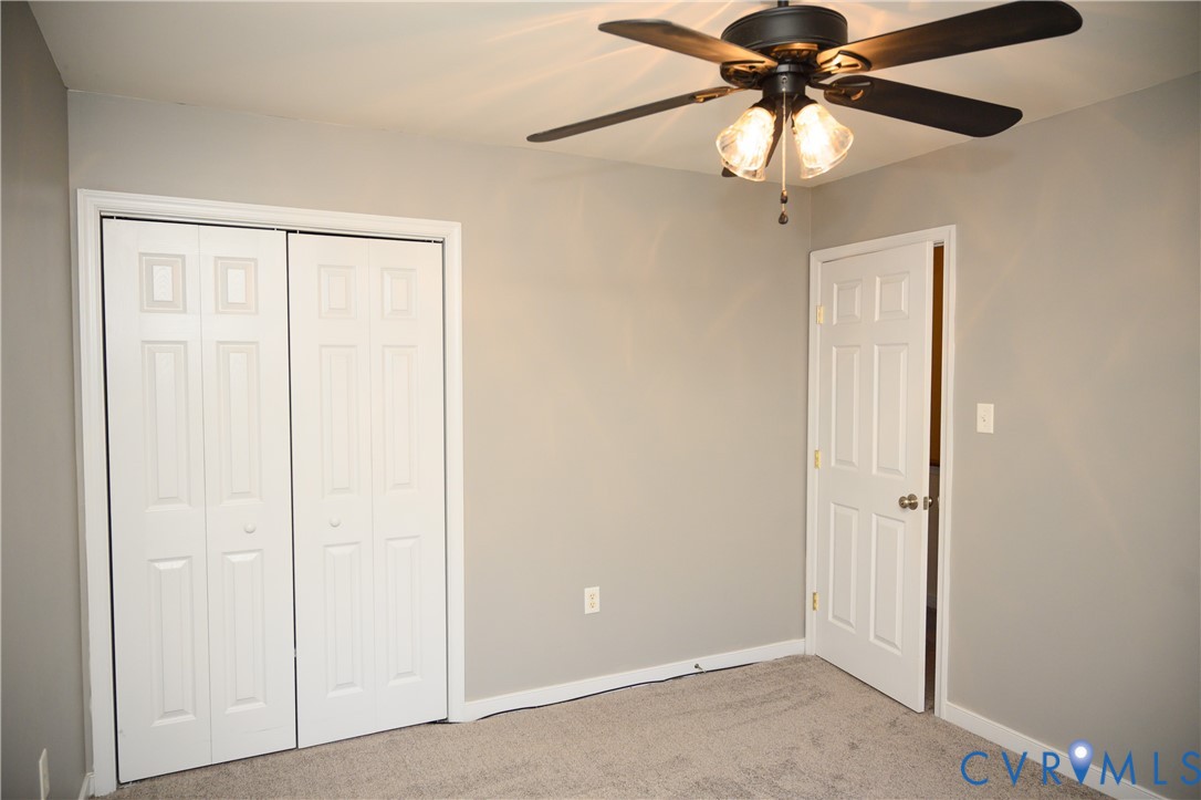 2143 Mountain View Road Powhatan, VA 23139 - Photo 24 of 34 an empty room with chandelier fan