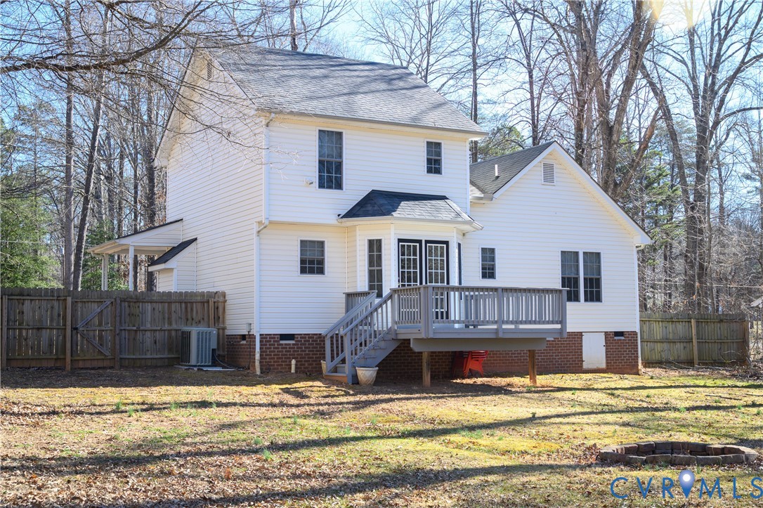 2143 Mountain View Road Powhatan, VA 23139 - Photo 29 of 34 a view of a white house with large windows next to a road