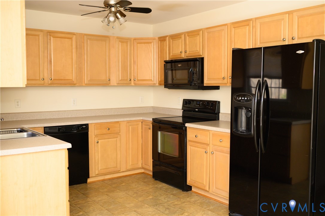 2143 Mountain View Road Powhatan, VA 23139 - Photo 3 of 34 a kitchen with a refrigerator stove and microwave