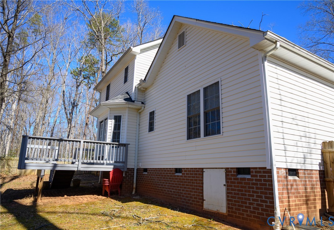 2143 Mountain View Road Powhatan, VA 23139 - Photo 33 of 34 a view of a roof deck with chair and wooden floor