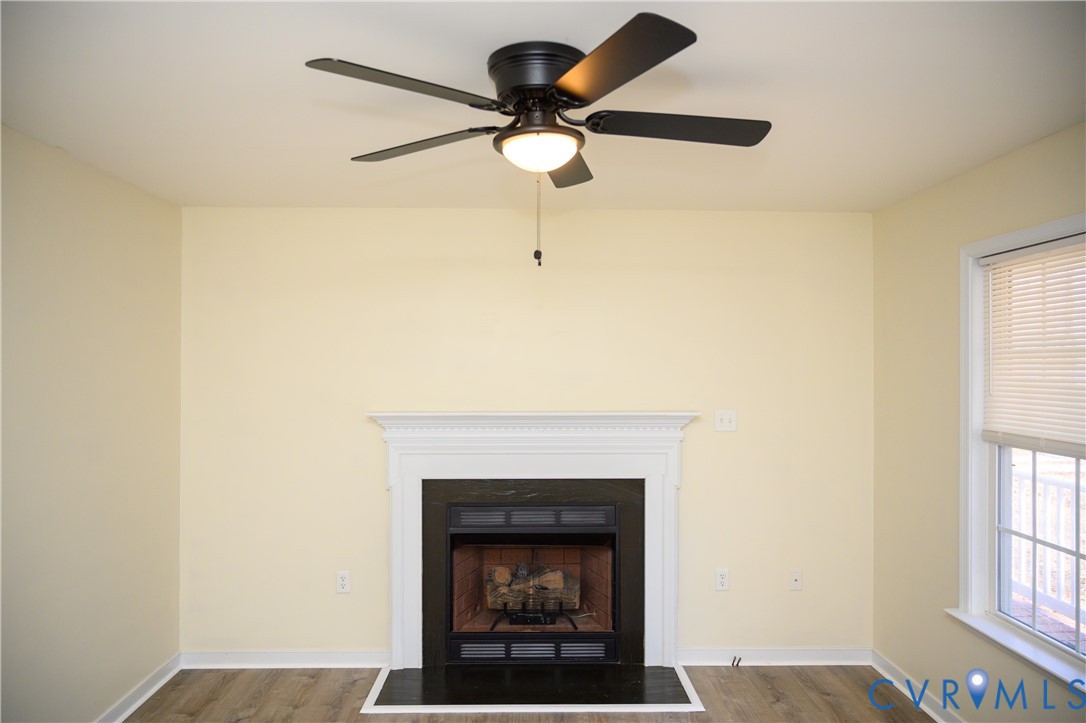 2143 Mountain View Road Powhatan, VA 23139 - Photo 6 of 34 a living room with a fireplace and a window