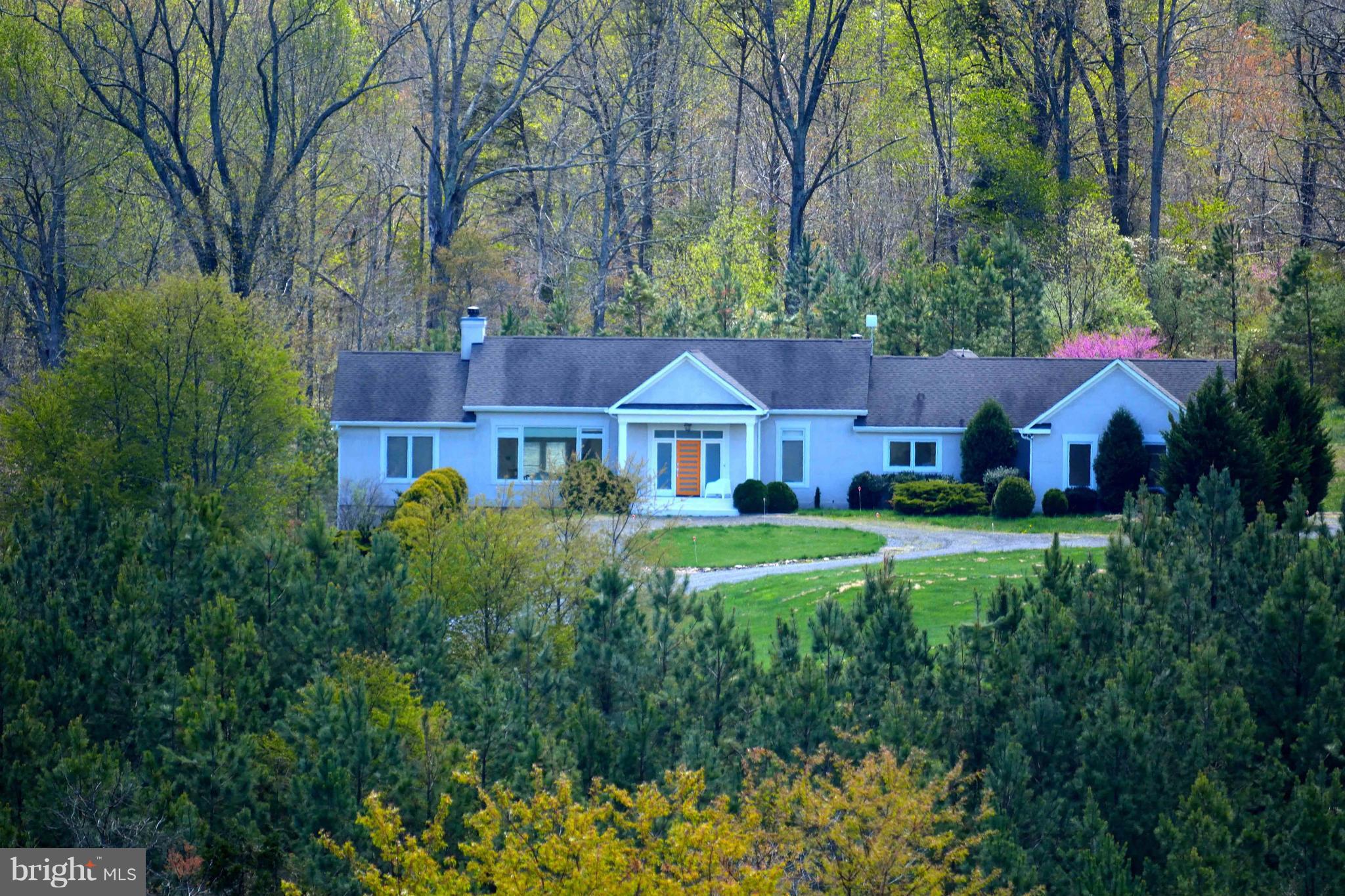 9859 Conde Road Marshall, VA 20115 - Photo 1 of 29 a front view of a house with garden