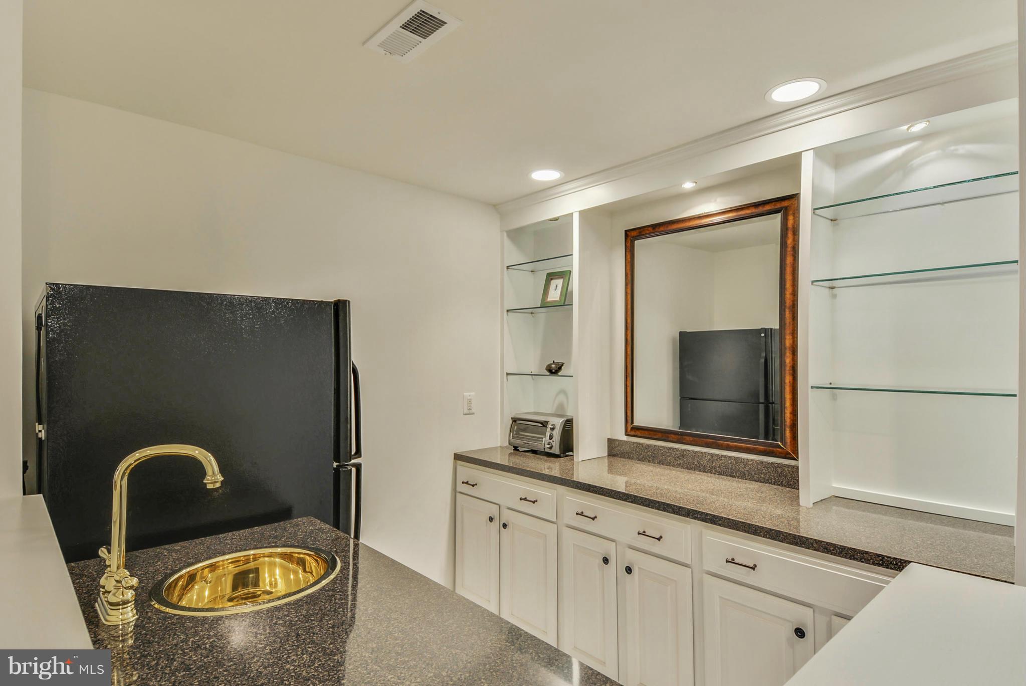 9859 Conde Road Marshall, VA 20115 - Photo 17 of 29 a bathroom with a granite countertop sink a mirror and a shower