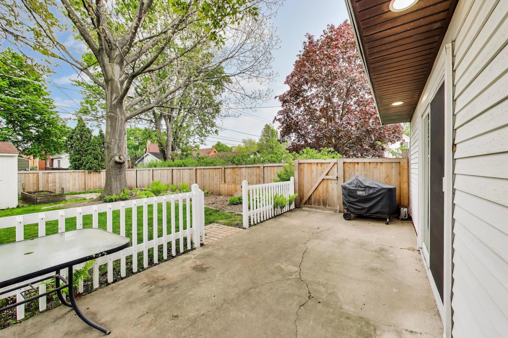 313 South Hi Lusi Avenue Mount Prospect, IL 60056 - Photo 35 of 40 a view of backyard with a deck and furniture
