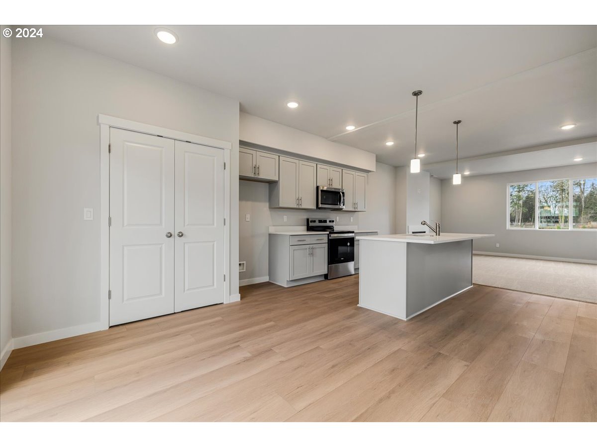 1485 North Chehalis Lane Newberg, OR 97132 - Photo 17 of 38 a view of kitchen with wooden floor