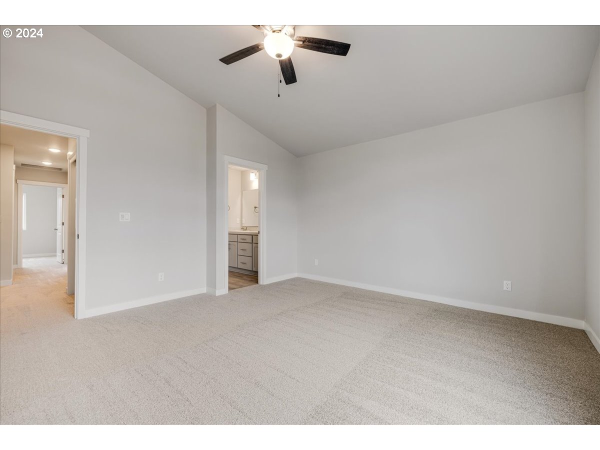 1485 North Chehalis Lane Newberg, OR 97132 - Photo 24 of 38 a view of an empty room with a ceiling fan