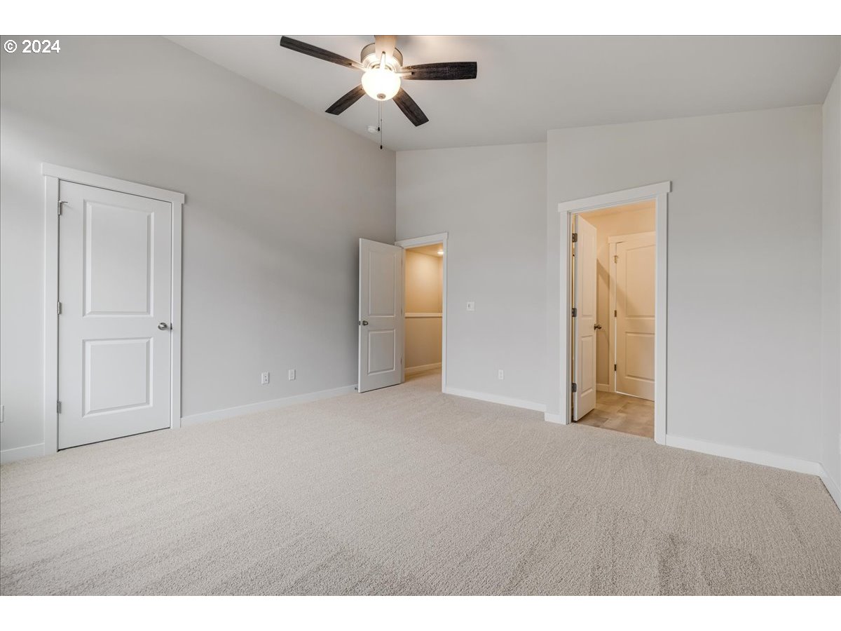 1485 North Chehalis Lane Newberg, OR 97132 - Photo 25 of 38 a view of an empty room and a ceiling fan