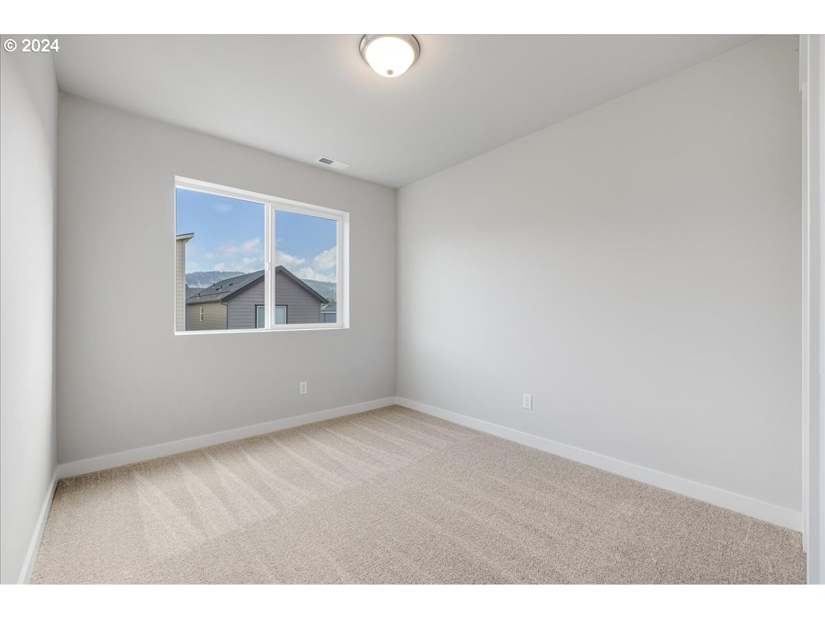 1485 North Chehalis Lane Newberg, OR 97132 - Photo 29 of 38 a view of an empty room with a window