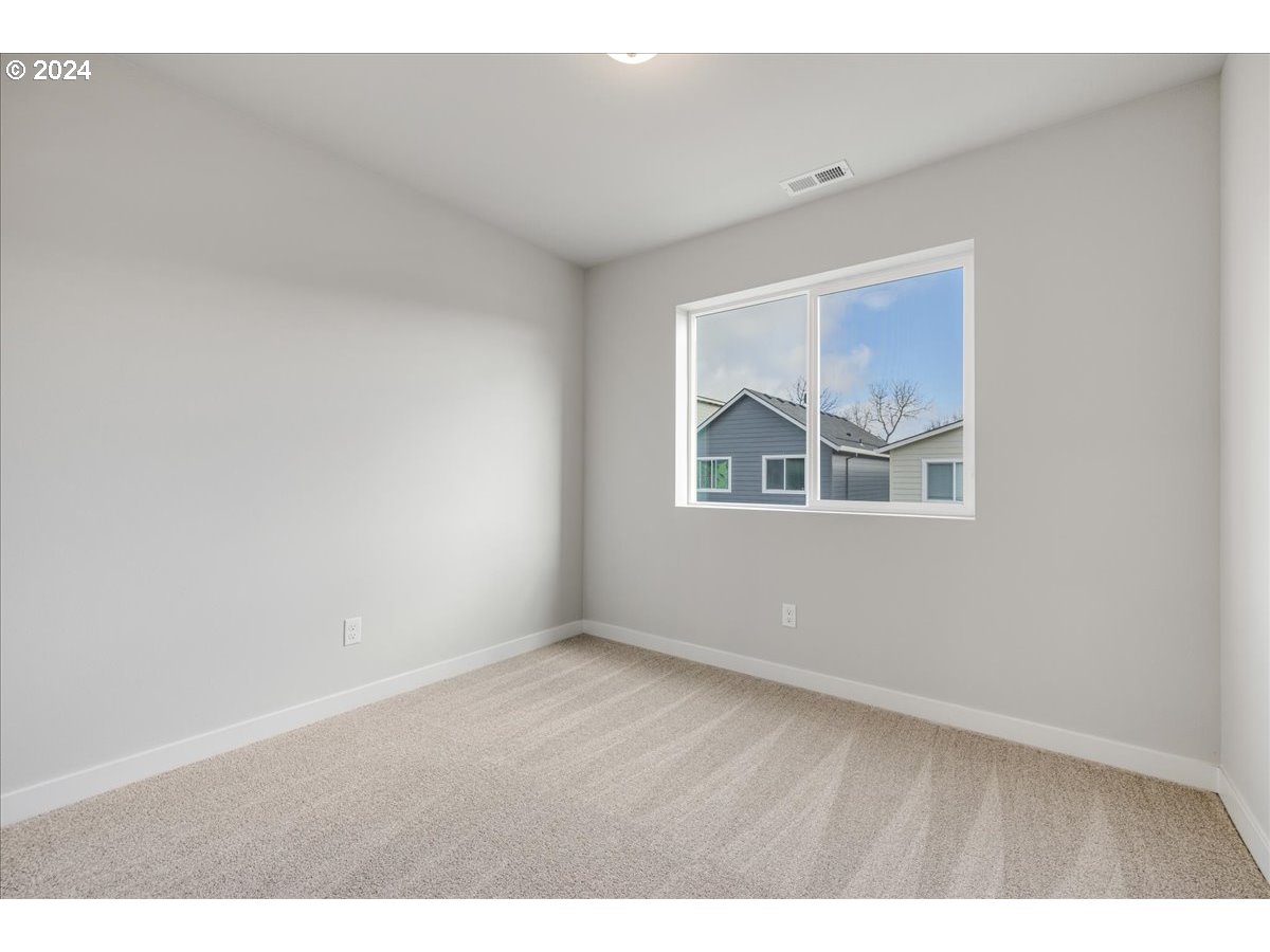 1485 North Chehalis Lane Newberg, OR 97132 - Photo 31 of 38 a view of an empty room with a window
