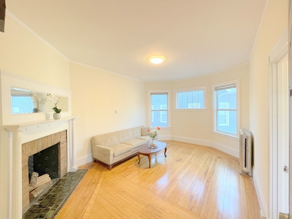 16 Dayton Street, Unit 2F Worcester, MA 01609 - Photo 1 of 21 a living room with furniture and a fireplace