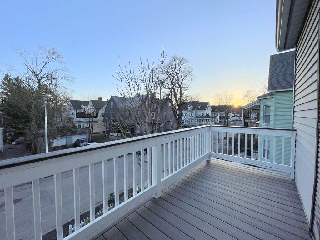 16 Dayton Street, Unit 2F Worcester, MA 01609 - Photo 17 of 21 a balcony with wooden floor and fence
