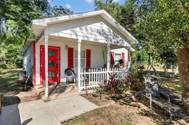 a view of a house with swimming pool and sitting area