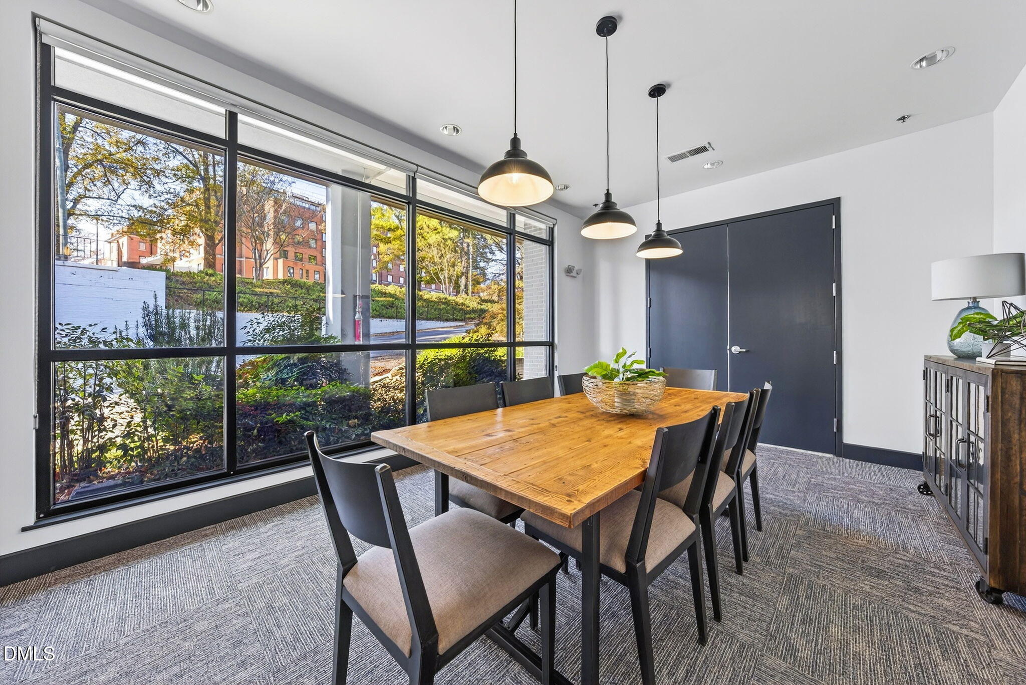1300 St Marys Street, Unit 203 Raleigh, NC 27605 - Photo 7 of 24 a view of a dining room with furniture window and outside view