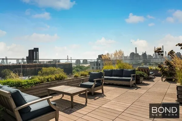 a view of a terrace with wooden benches