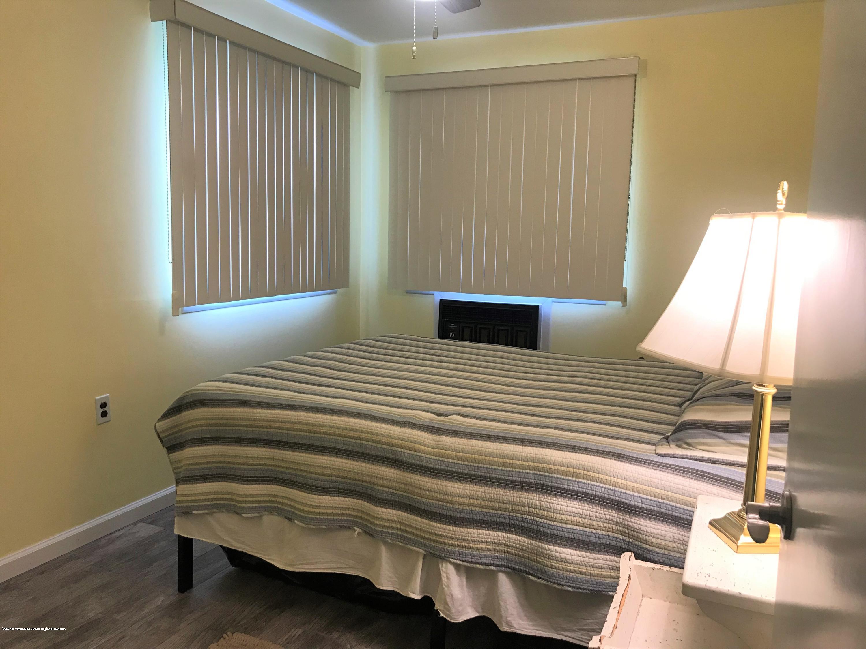40 A Sunset Road Whiting, NJ 08759 - Photo 11 of 17 a bedroom with a bed and a window