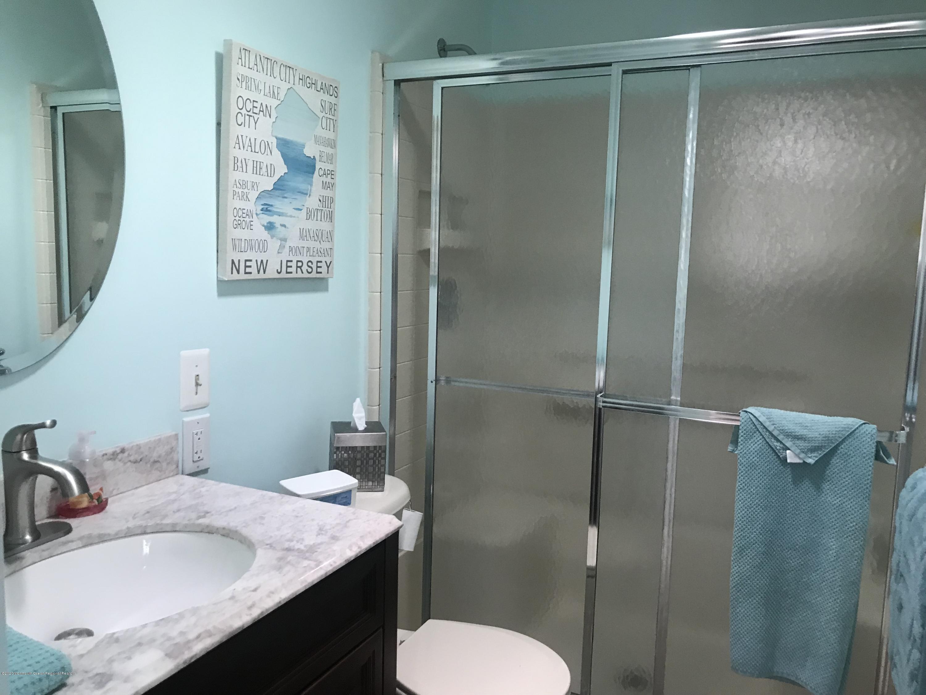 40 A Sunset Road Whiting, NJ 08759 - Photo 12 of 17 a bathroom with a granite countertop sink toilet and shower