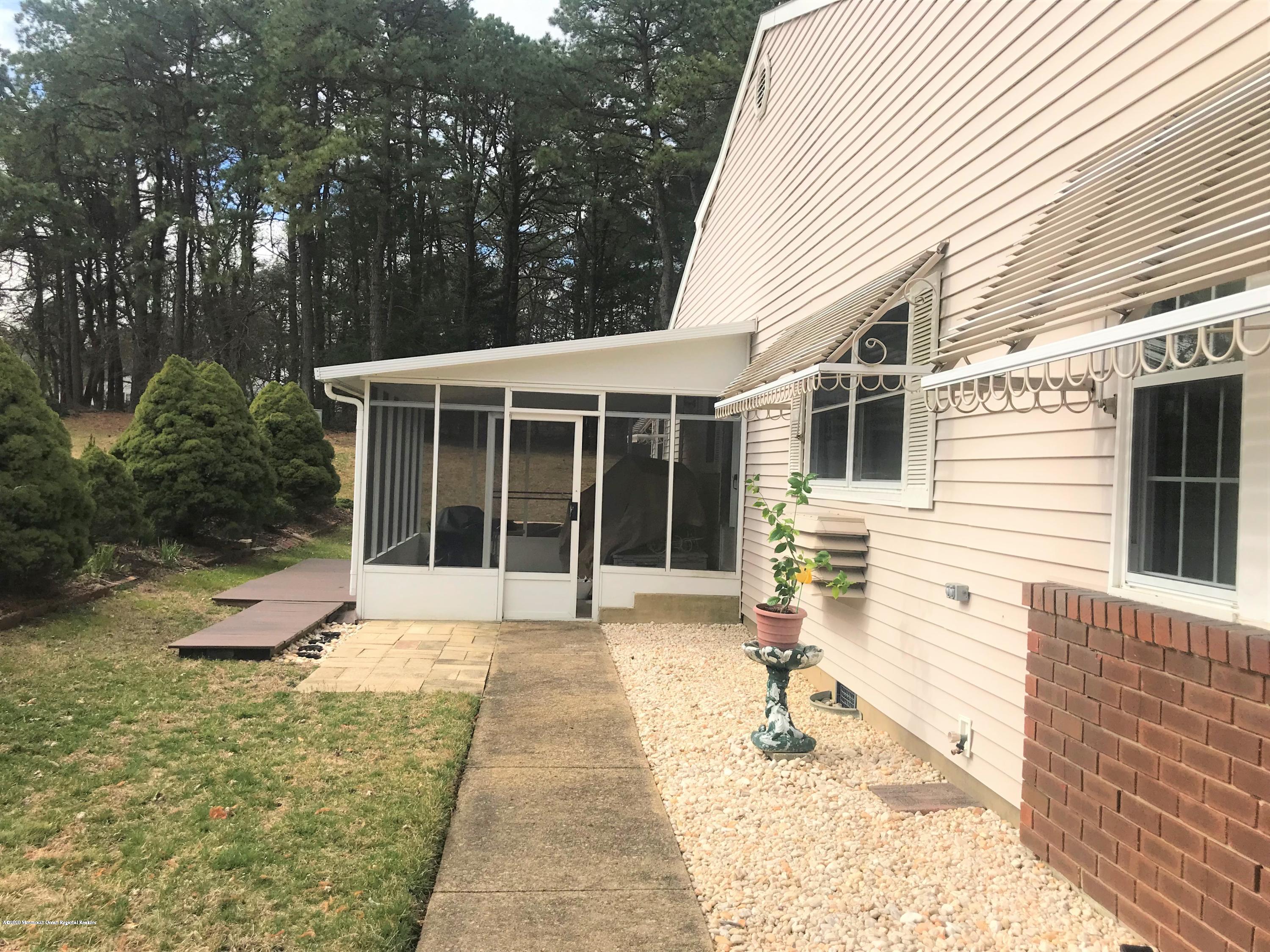 40 A Sunset Road Whiting, NJ 08759 - Photo 14 of 17 a front view of a house with a patio