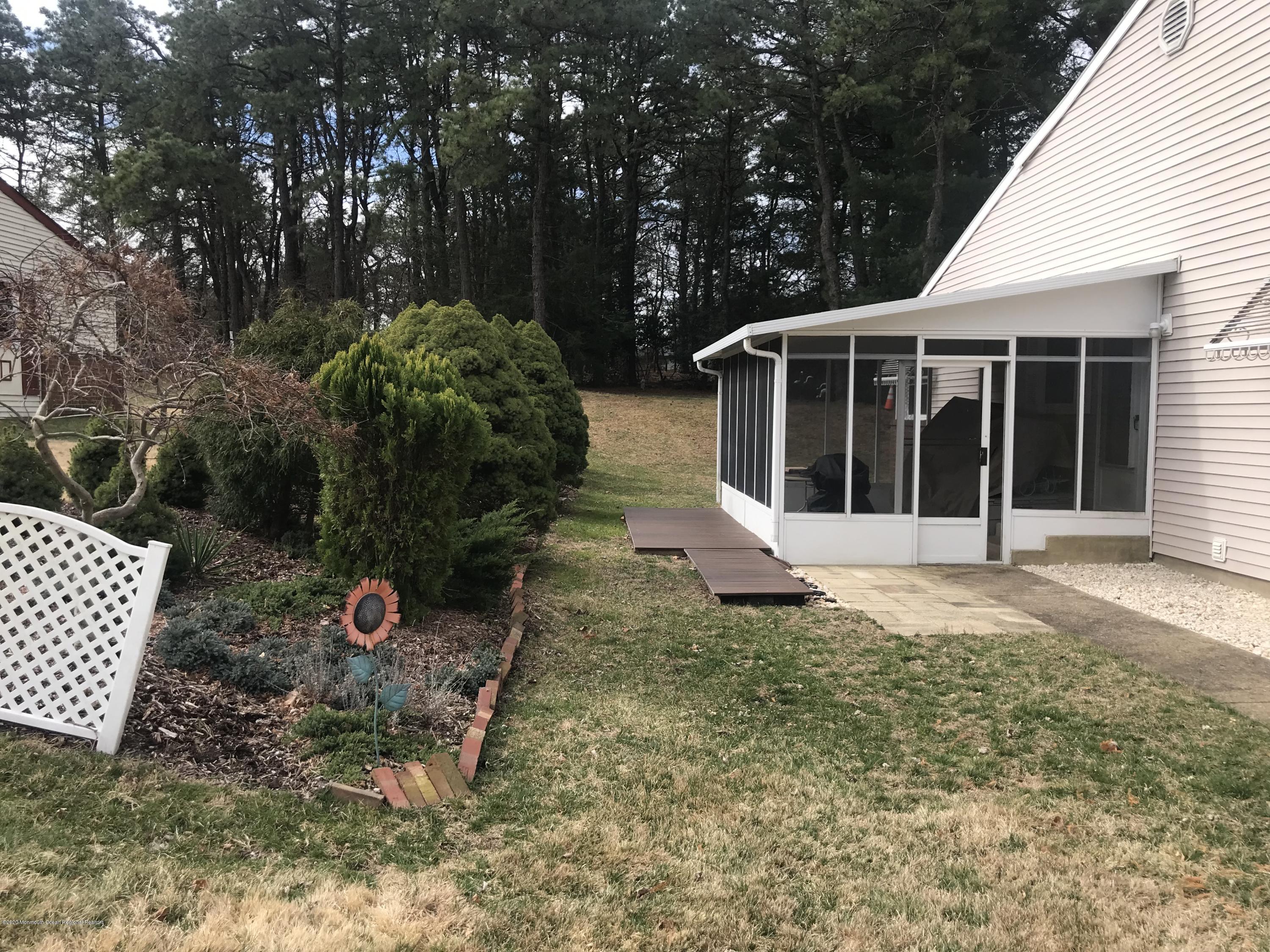 40 A Sunset Road Whiting, NJ 08759 - Photo 15 of 17 a view of house with backyard space and garden