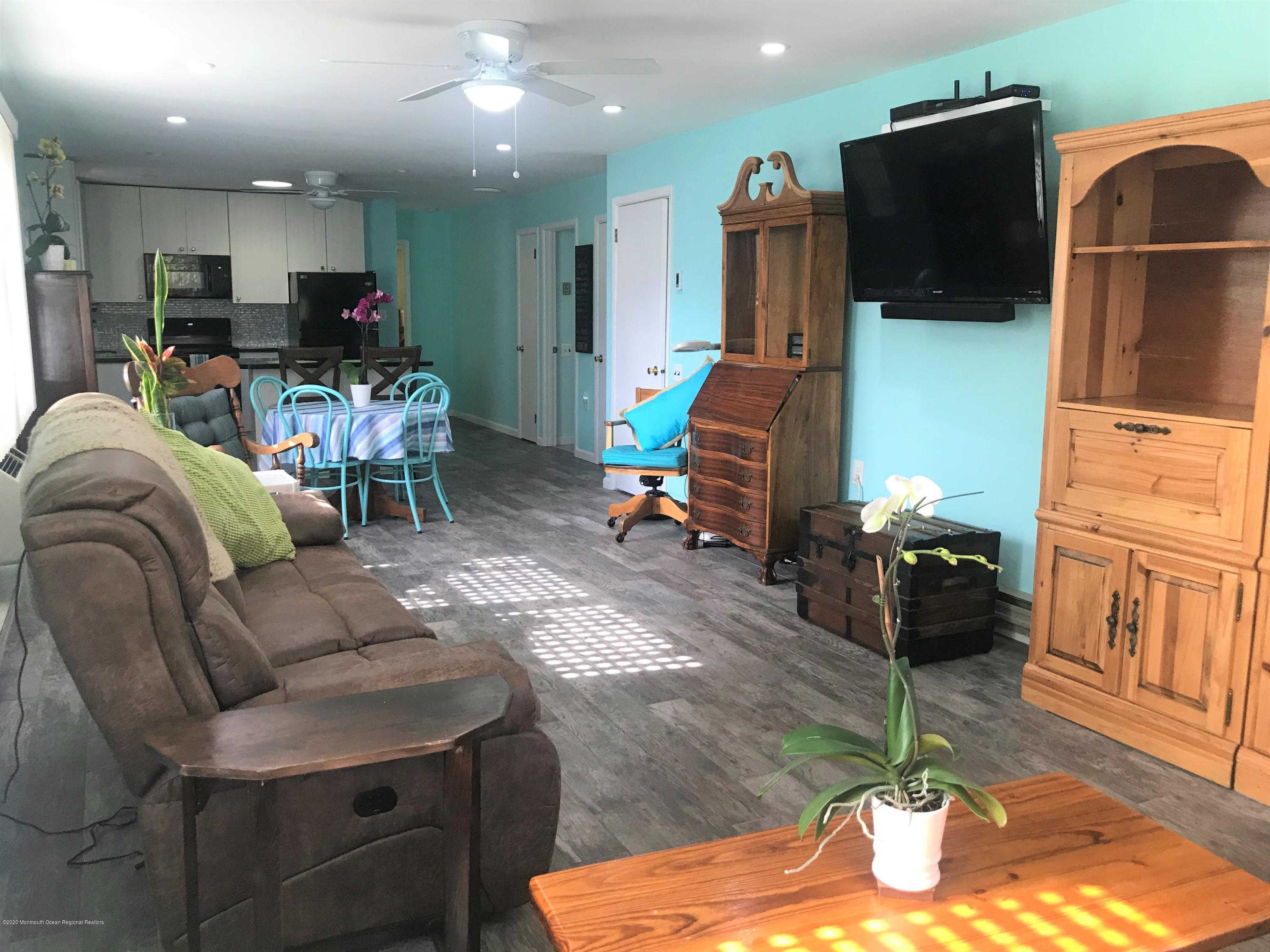 40 A Sunset Road Whiting, NJ 08759 - Photo 3 of 17 a living room with furniture and a flat screen tv