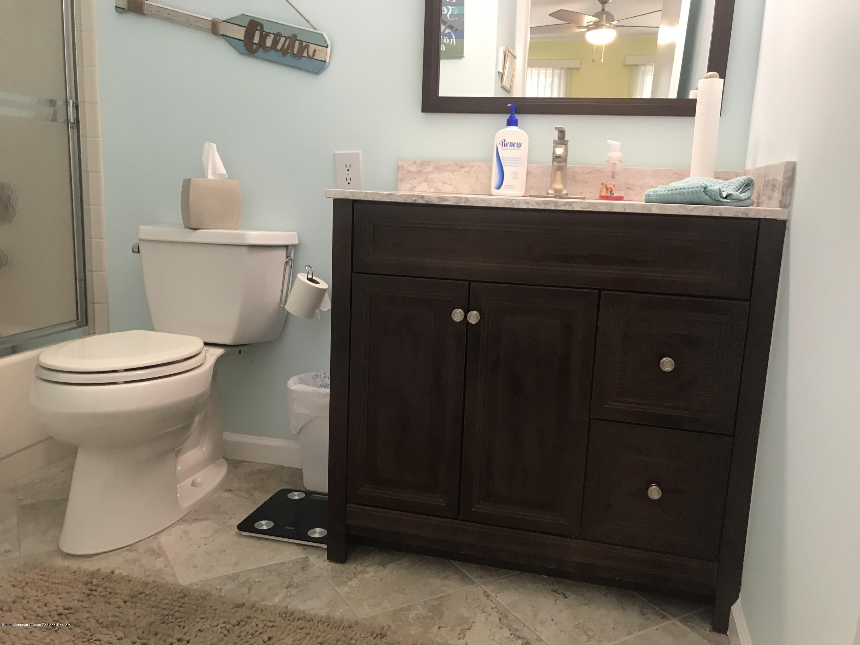 40 A Sunset Road Whiting, NJ 08759 - Photo 10 of 17 a bathroom with a sink toilet and vanity