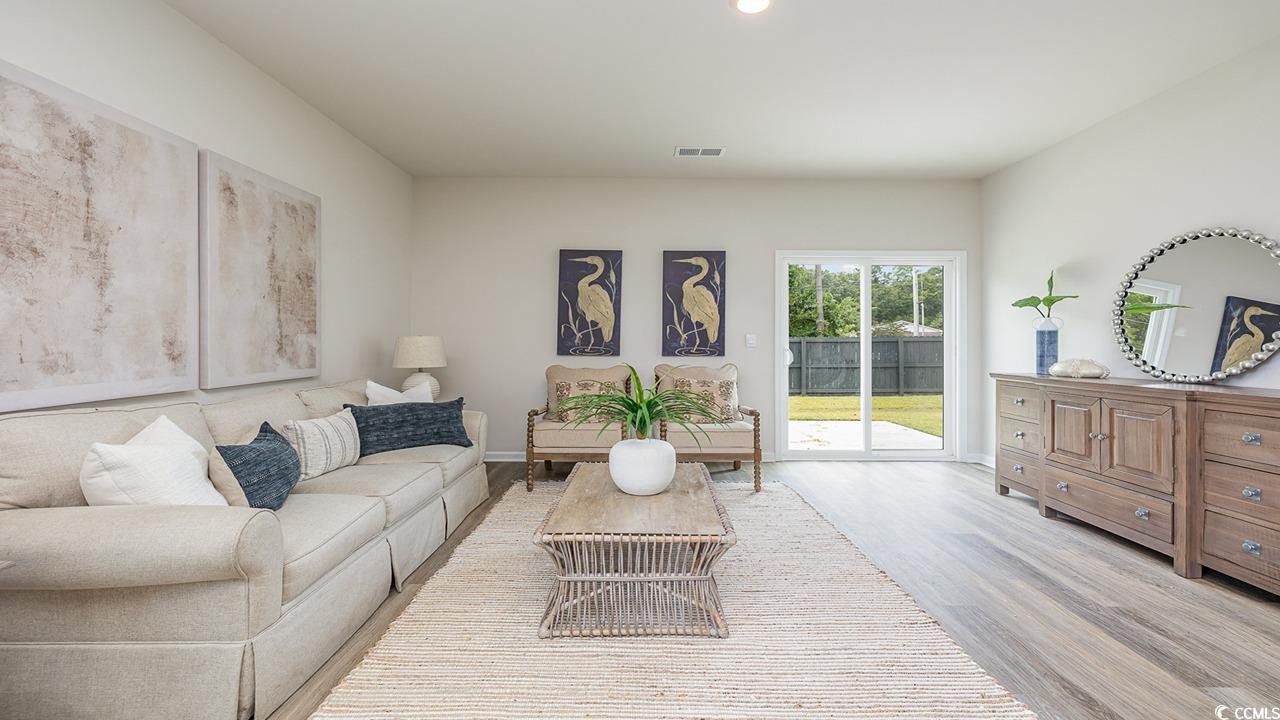303 Ridley Street Longs, SC 29568 - Photo 13 of 31 Living room featuring wood finished floors