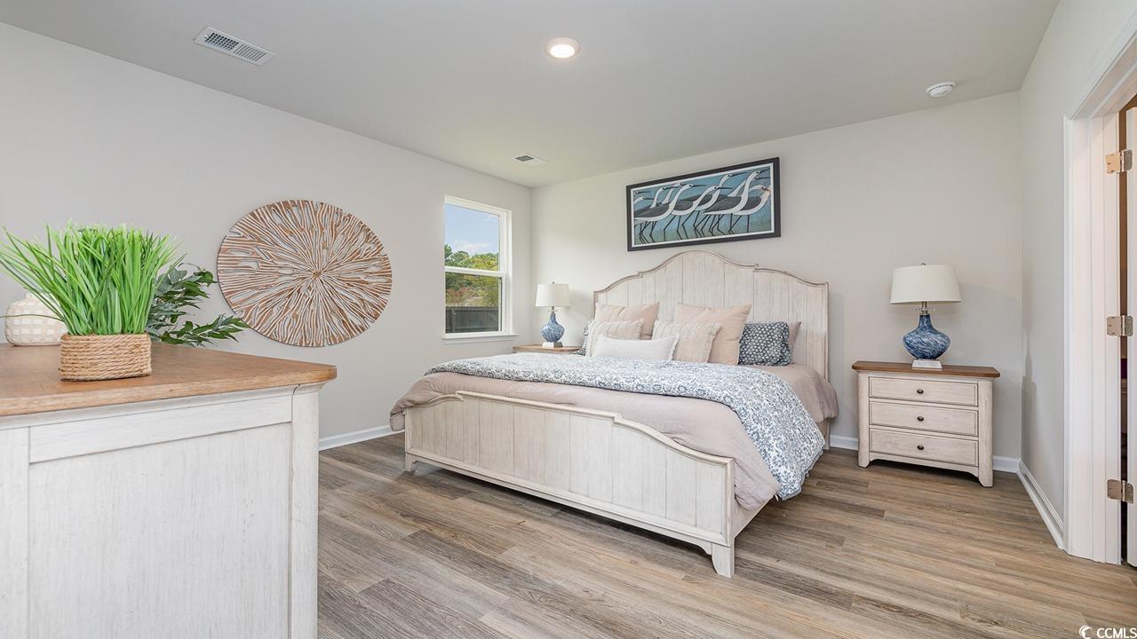 303 Ridley Street Longs, SC 29568 - Photo 14 of 31 Bedroom featuring light wood-style floors and recessed lighting