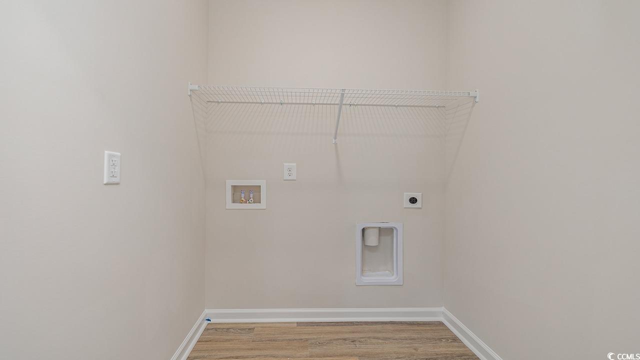 303 Ridley Street Longs, SC 29568 - Photo 19 of 31 Laundry room with hookup for an electric dryer, light wood finished floors, and washer hookup