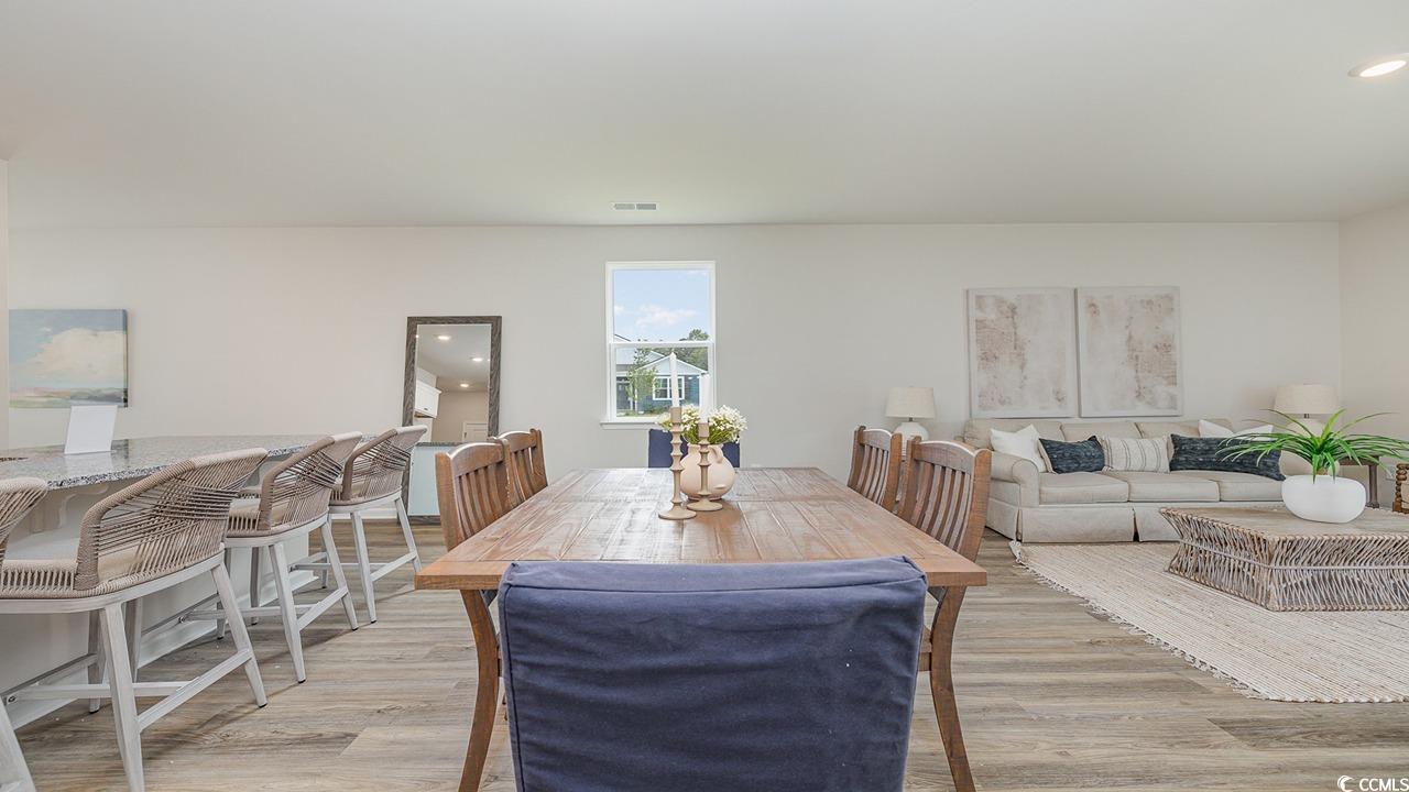 303 Ridley Street Longs, SC 29568 - Photo 9 of 31 Dining space with light wood-type flooring and recessed lighting