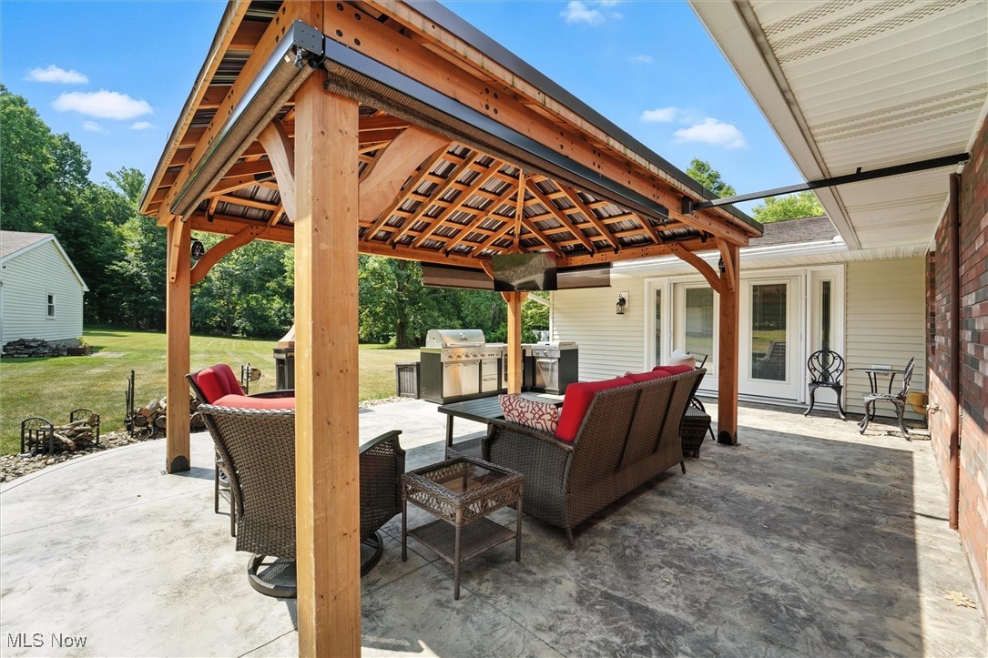 2930 South Ridge Road East Kingsville, OH 44048 - Photo 35 of 49 View of patio featuring an outdoor living space, a pergola, and area for grilling