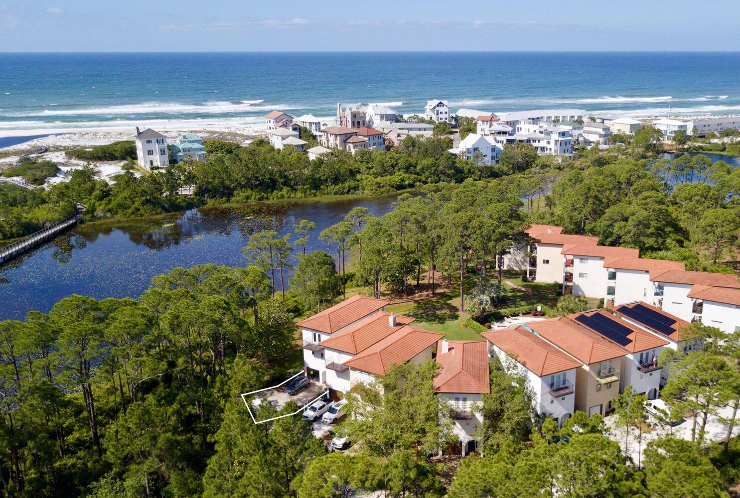 an aerial view of a houses with a lake view