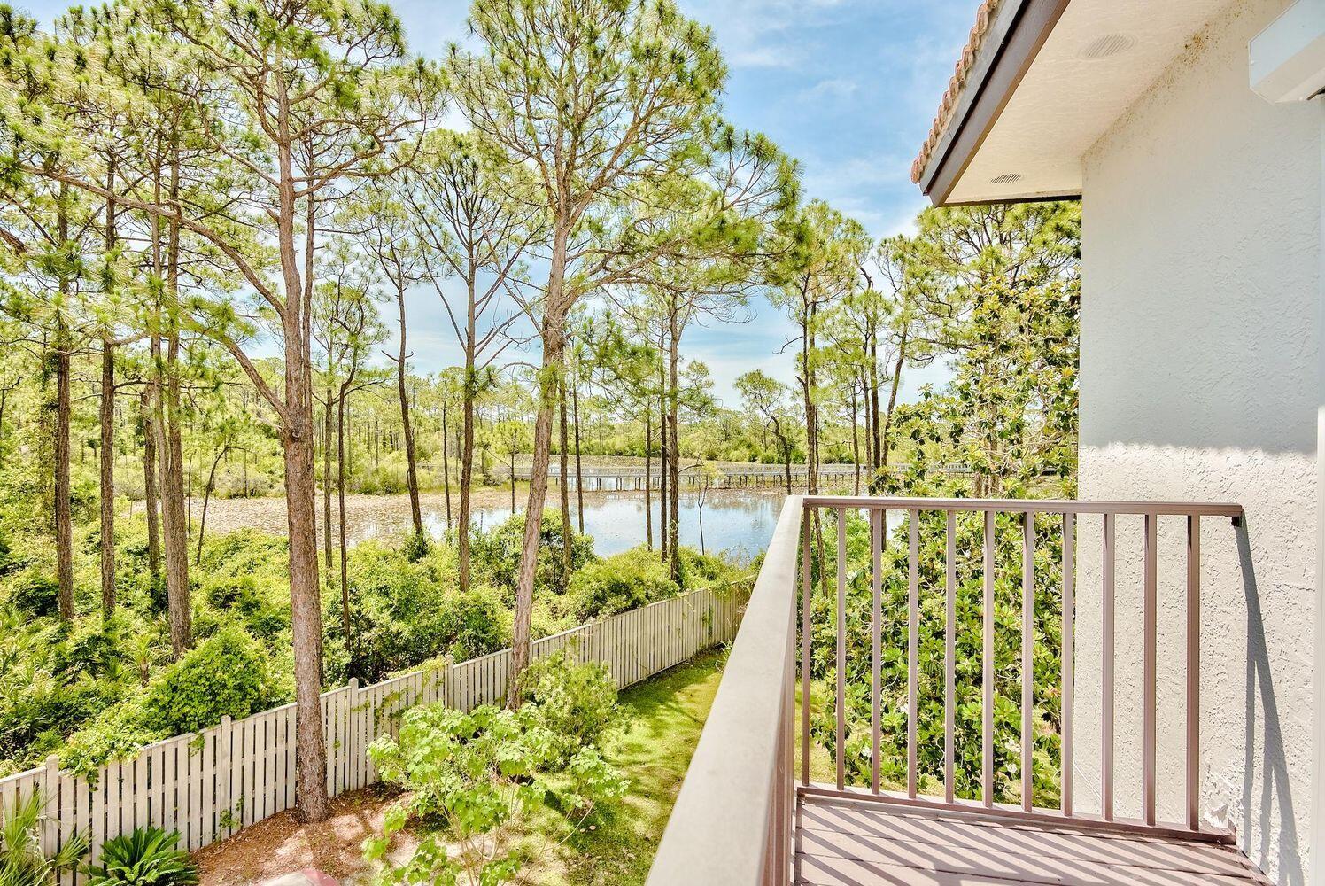 114 Mar-A-Lago Boulevard, Unit 1 Santa Rosa Beach, FL 32459 - Photo 15 of 28 a view of balcony with wooden floor and fence