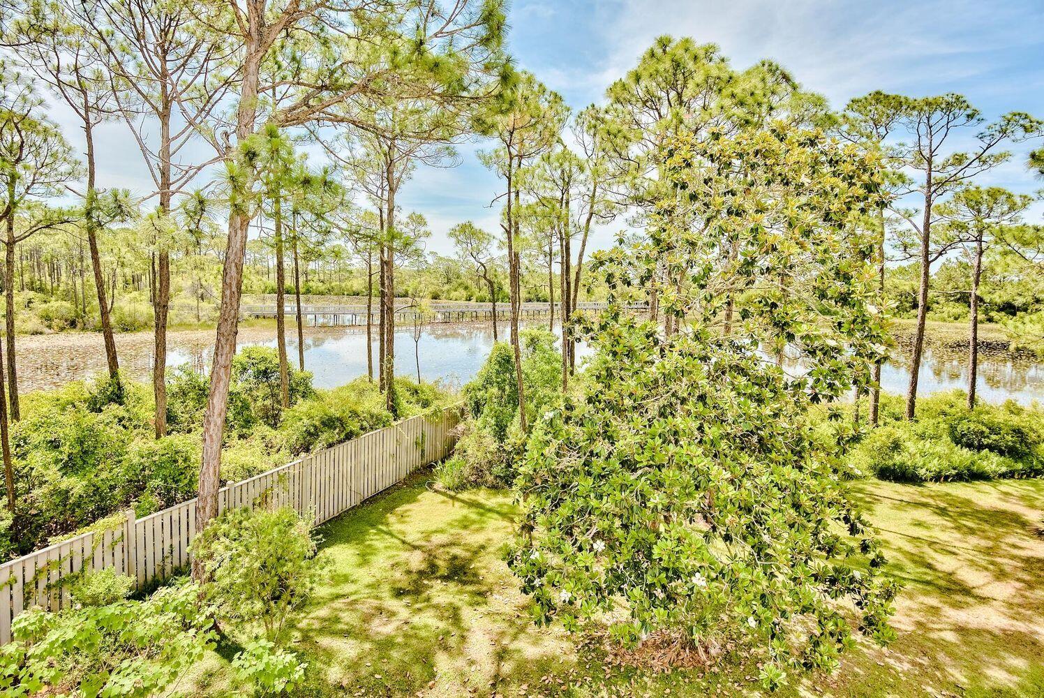 114 Mar-A-Lago Boulevard, Unit 1 Santa Rosa Beach, FL 32459 - Photo 16 of 28 a view of a garden with plants and flowers