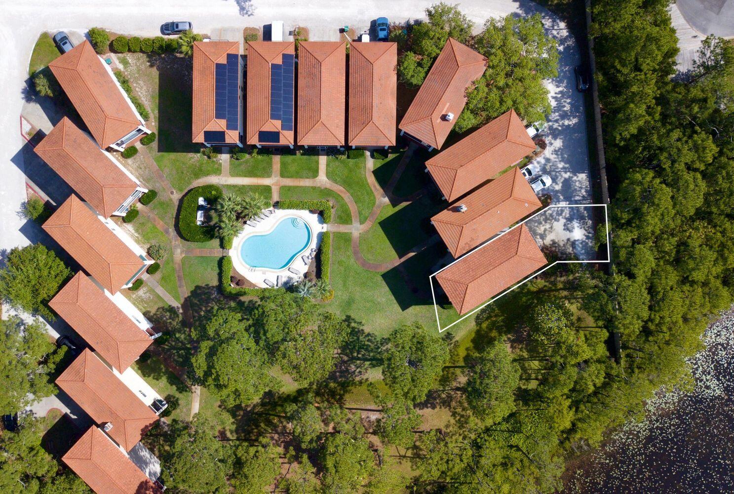 114 Mar-A-Lago Boulevard, Unit 1 Santa Rosa Beach, FL 32459 - Photo 18 of 28 an aerial view of a house with outdoor space pool seating area and yard