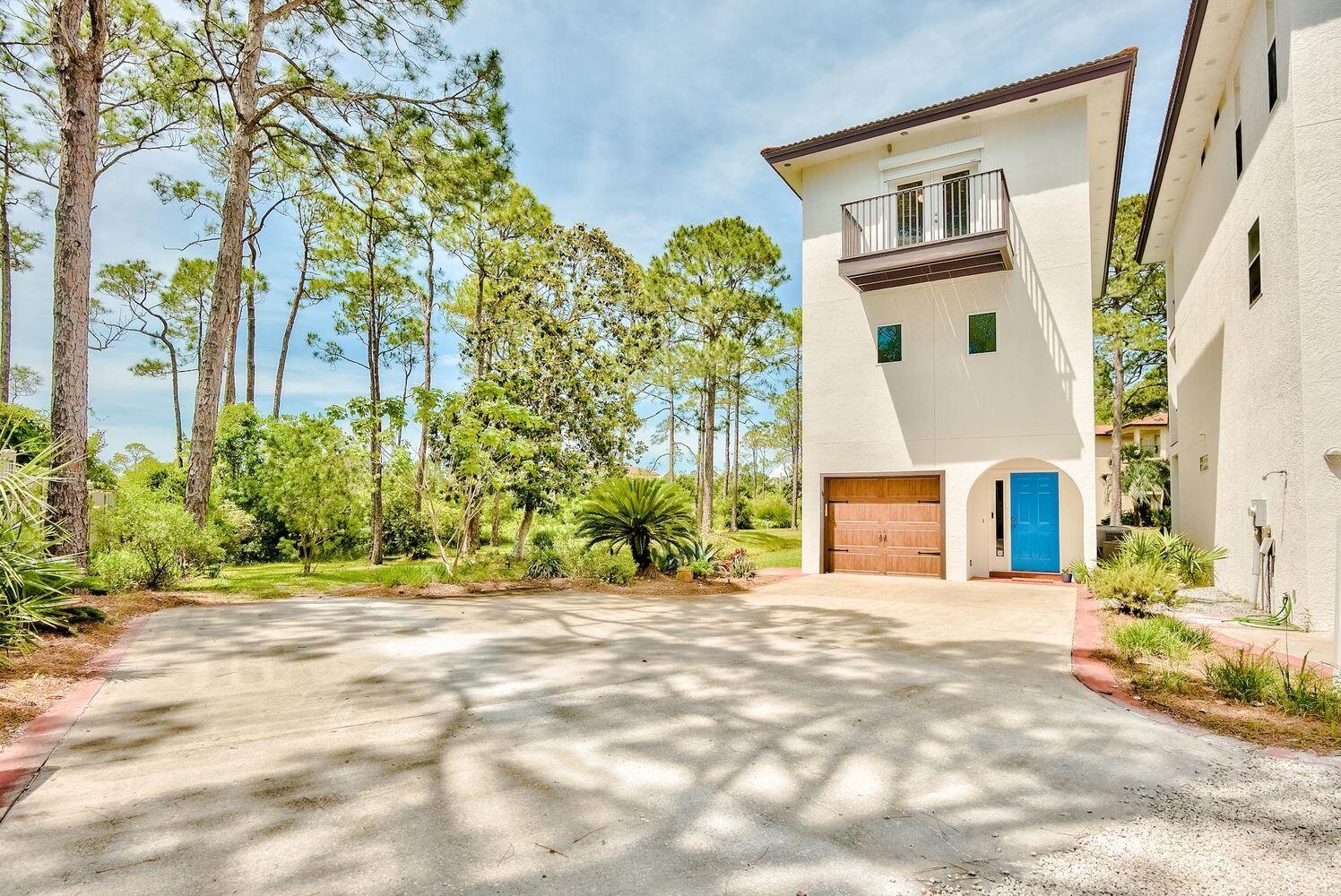 114 Mar-A-Lago Boulevard, Unit 1 Santa Rosa Beach, FL 32459 - Photo 21 of 28 a view of a house with a backyard