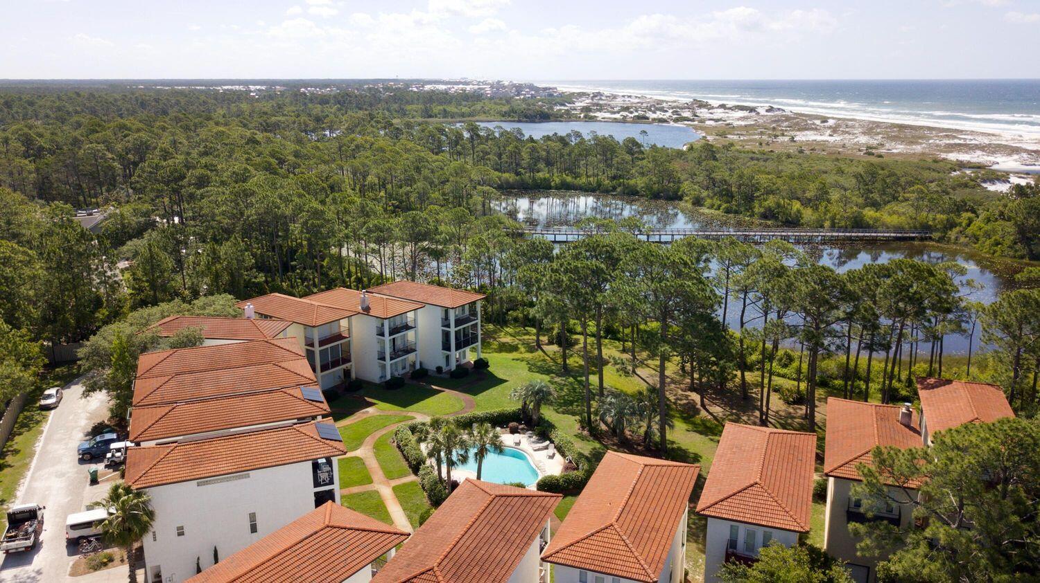 114 Mar-A-Lago Boulevard, Unit 1 Santa Rosa Beach, FL 32459 - Photo 23 of 28 an aerial view of a house with a lake view