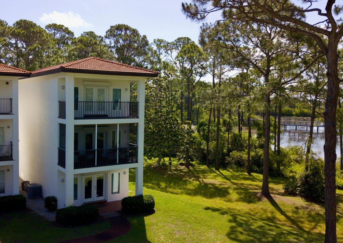 114 Mar-A-Lago Boulevard, Unit 1 Santa Rosa Beach, FL 32459 - Photo 25 of 28 a view of a house with swimming pool next to a yard