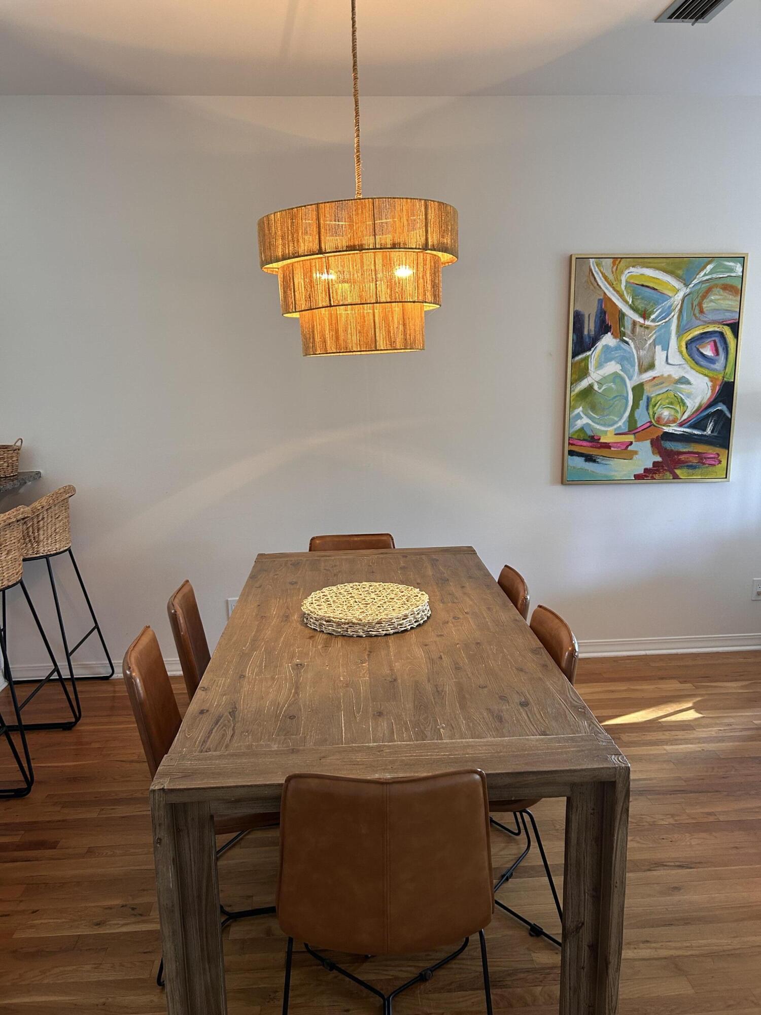 114 Mar-A-Lago Boulevard, Unit 1 Santa Rosa Beach, FL 32459 - Photo 35 of 49 a view of a dining room with furniture and wooden floor