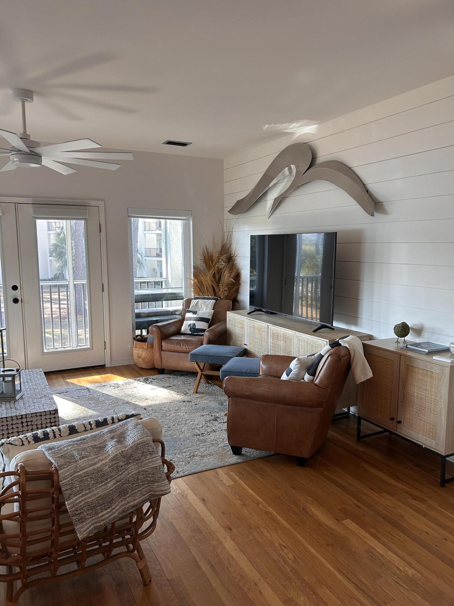 114 Mar-A-Lago Boulevard, Unit 1 Santa Rosa Beach, FL 32459 - Photo 39 of 49 a living room with furniture and a fireplace