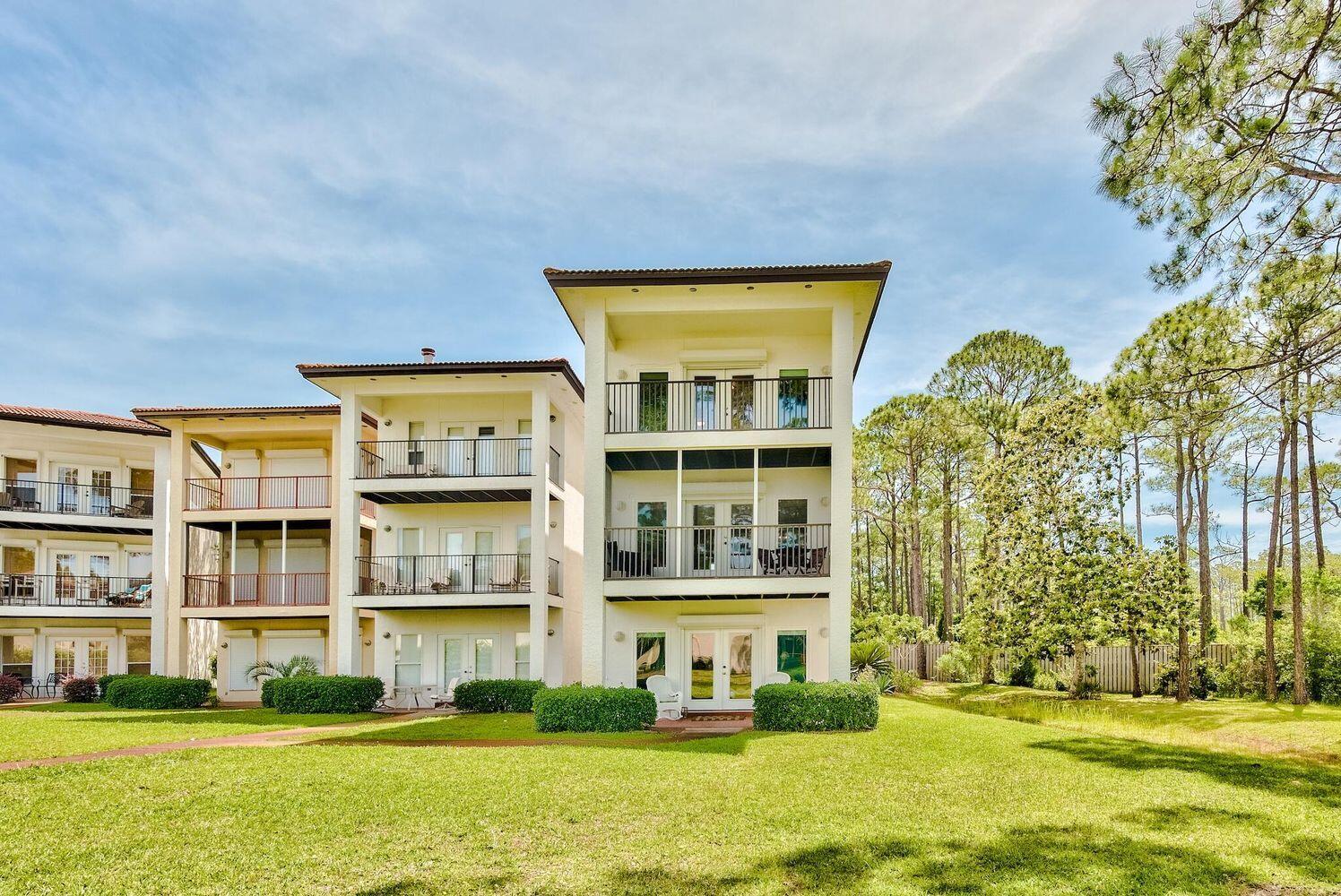 114 Mar-A-Lago Boulevard, Unit 1 Santa Rosa Beach, FL 32459 - Photo 4 of 28 a front view of a building with a swimming pool