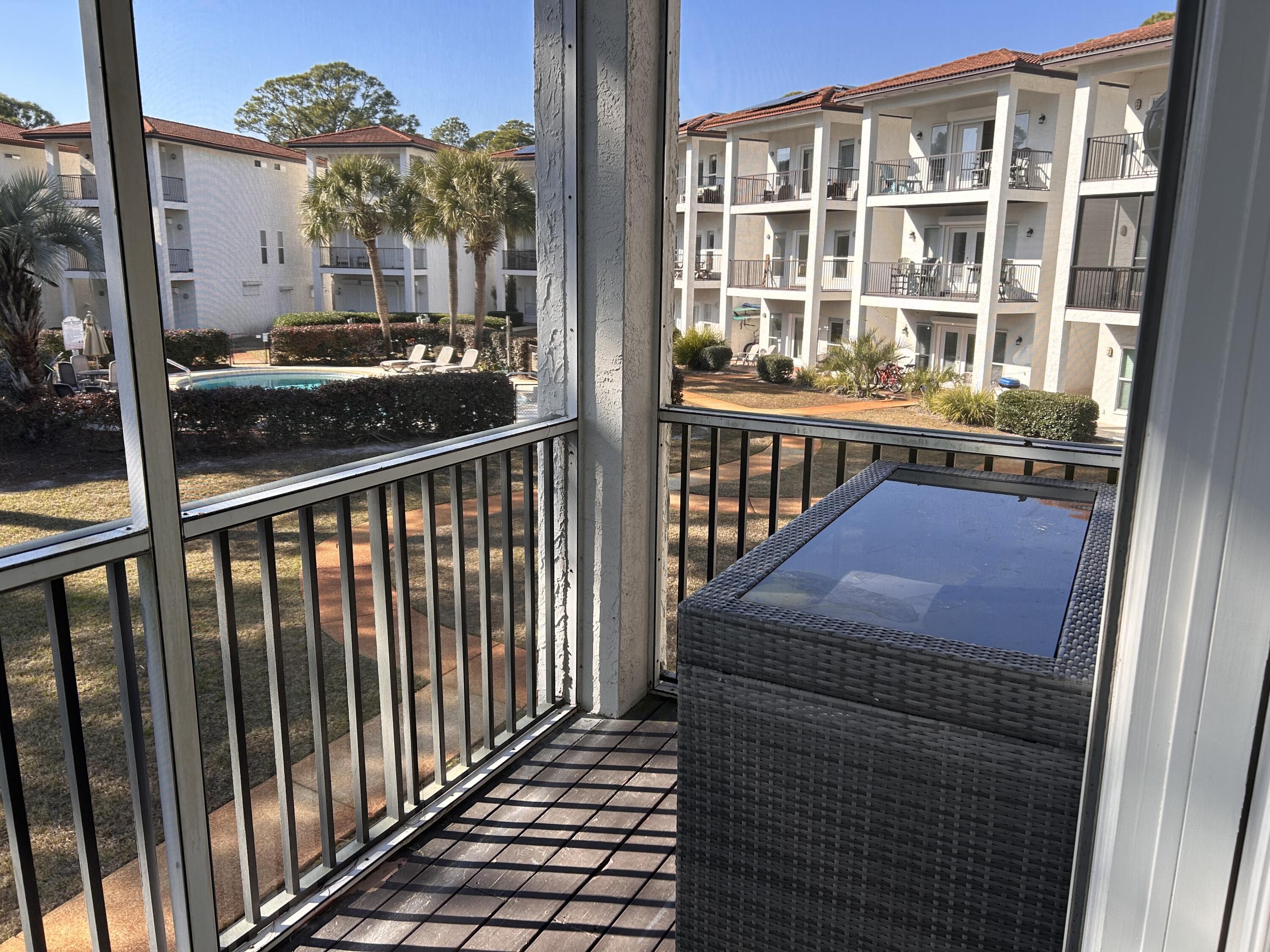 114 Mar-A-Lago Boulevard, Unit 1 Santa Rosa Beach, FL 32459 - Photo 41 of 49 a view of a brick building from a balcony