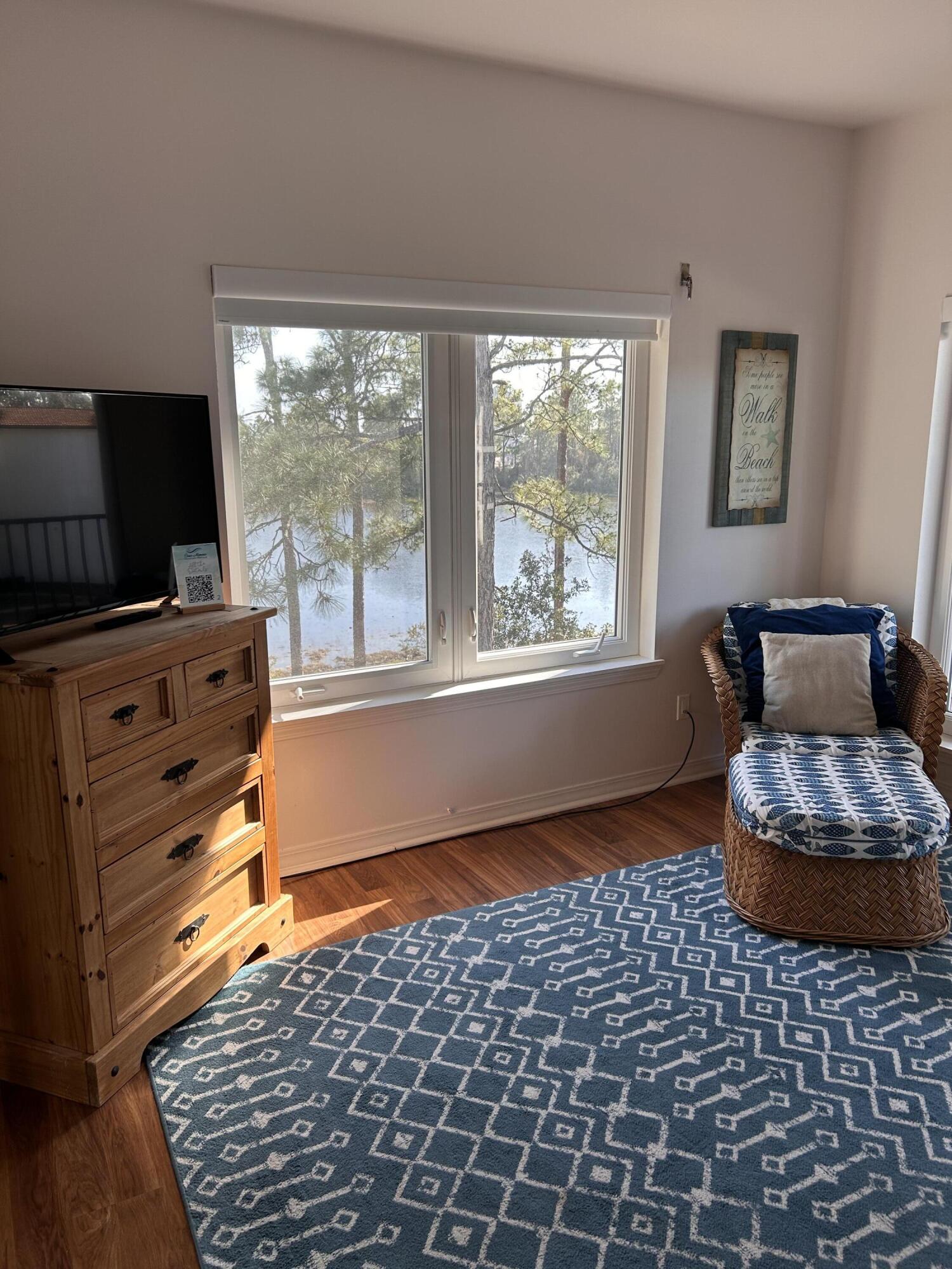 114 Mar-A-Lago Boulevard, Unit 1 Santa Rosa Beach, FL 32459 - Photo 44 of 49 a living room with furniture and a flat screen tv
