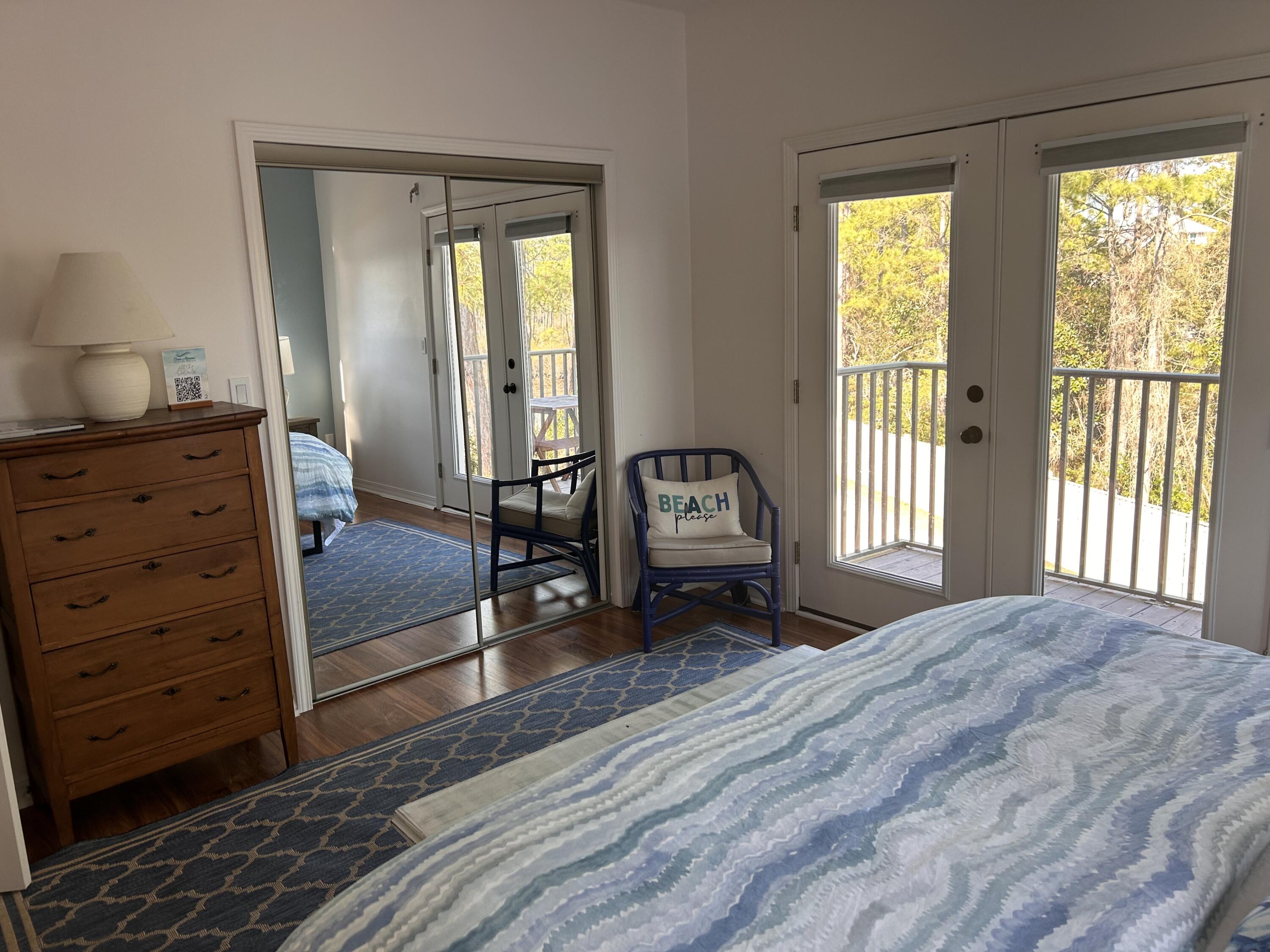 114 Mar-A-Lago Boulevard, Unit 1 Santa Rosa Beach, FL 32459 - Photo 47 of 49 a living room with a bed furniture and a window