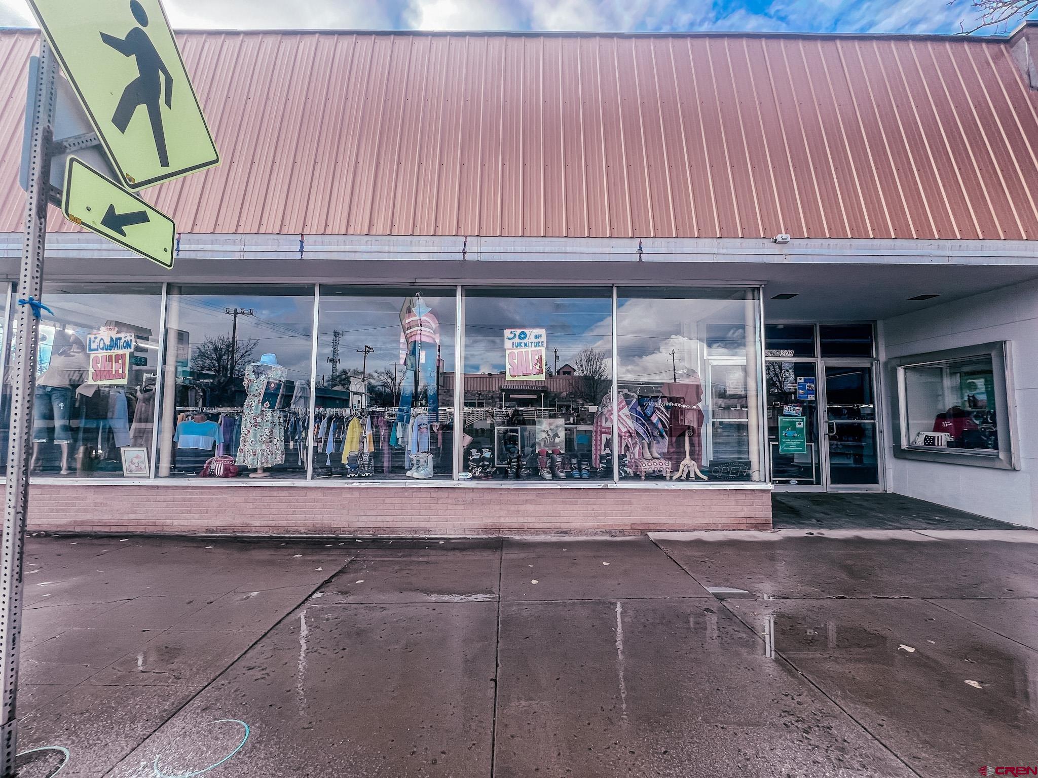 209 West Main Street Cortez, CO 81321 - Photo 2 of 18 a view of a food mall next to a road