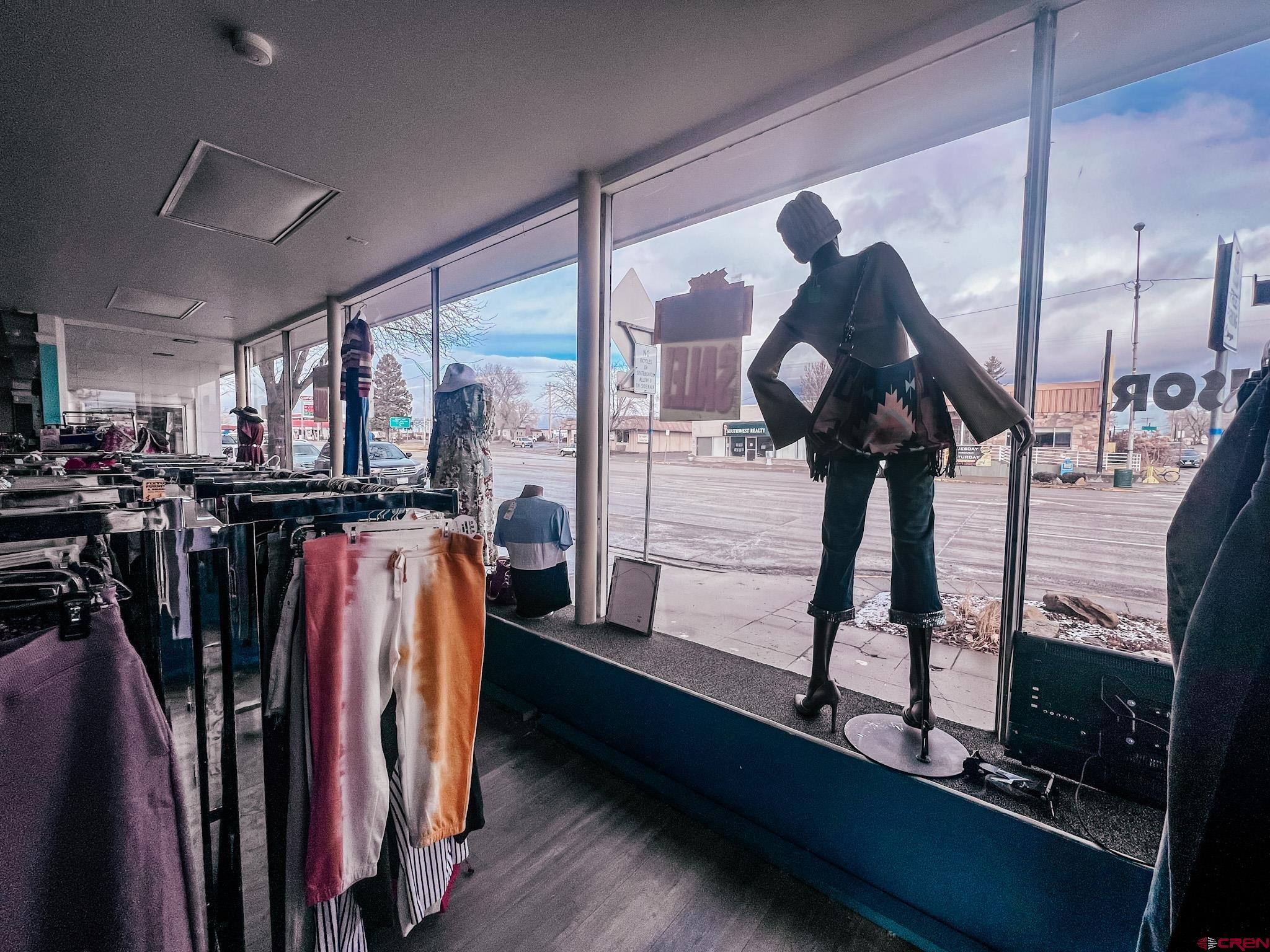 209 West Main Street Cortez, CO 81321 - Photo 5 of 18 a view of walk in closet with clothes and shoes