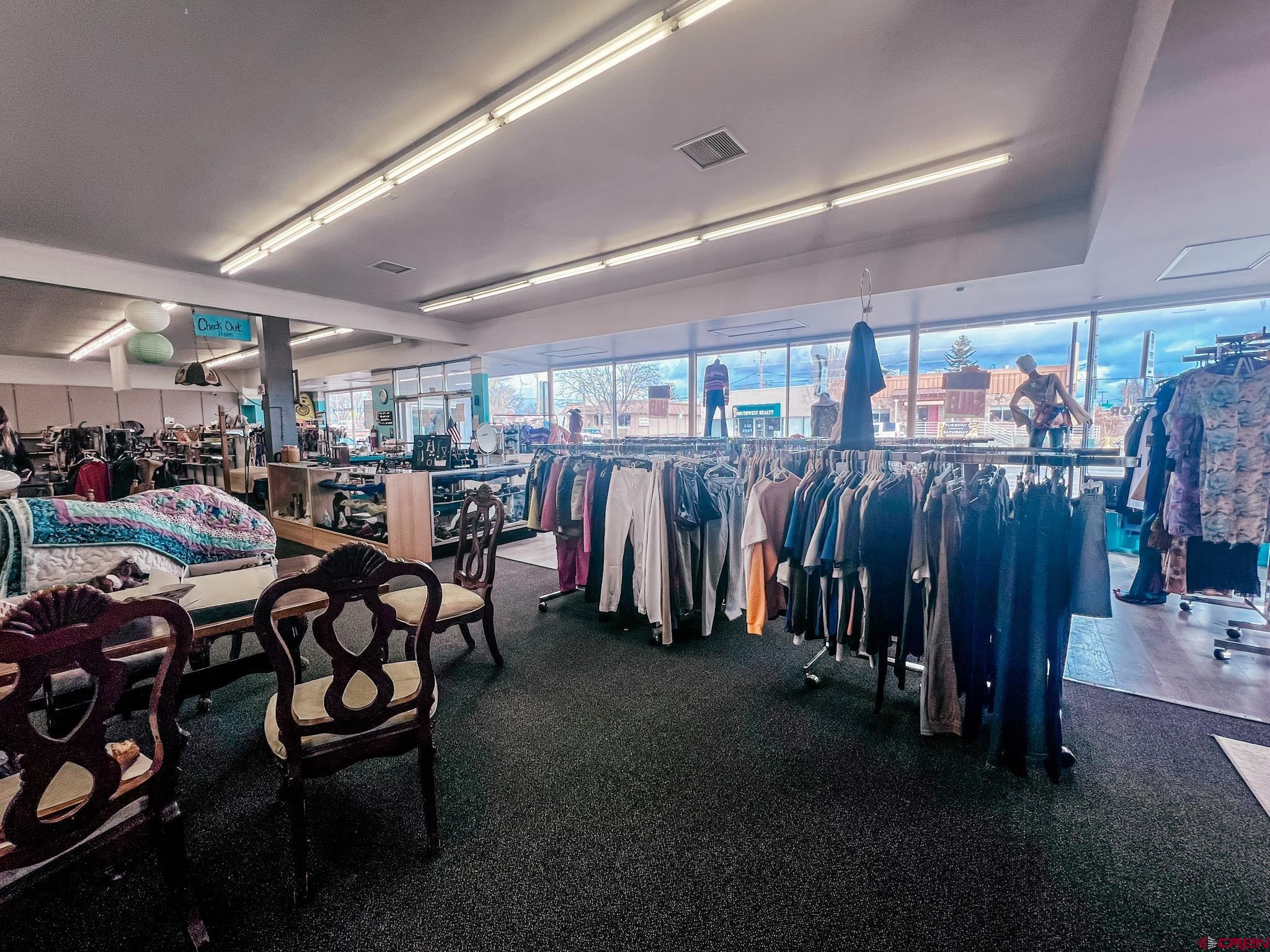209 West Main Street Cortez, CO 81321 - Photo 6 of 18 a view of a room with lots of wooden furniture