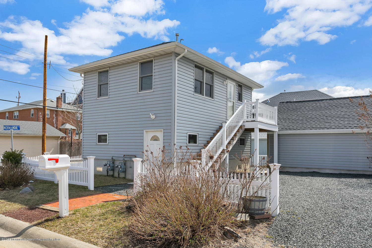 1 Beach Way, Unit A Sea Bright, NJ 07760 - Photo 2 of 15 a front view of a house with garden