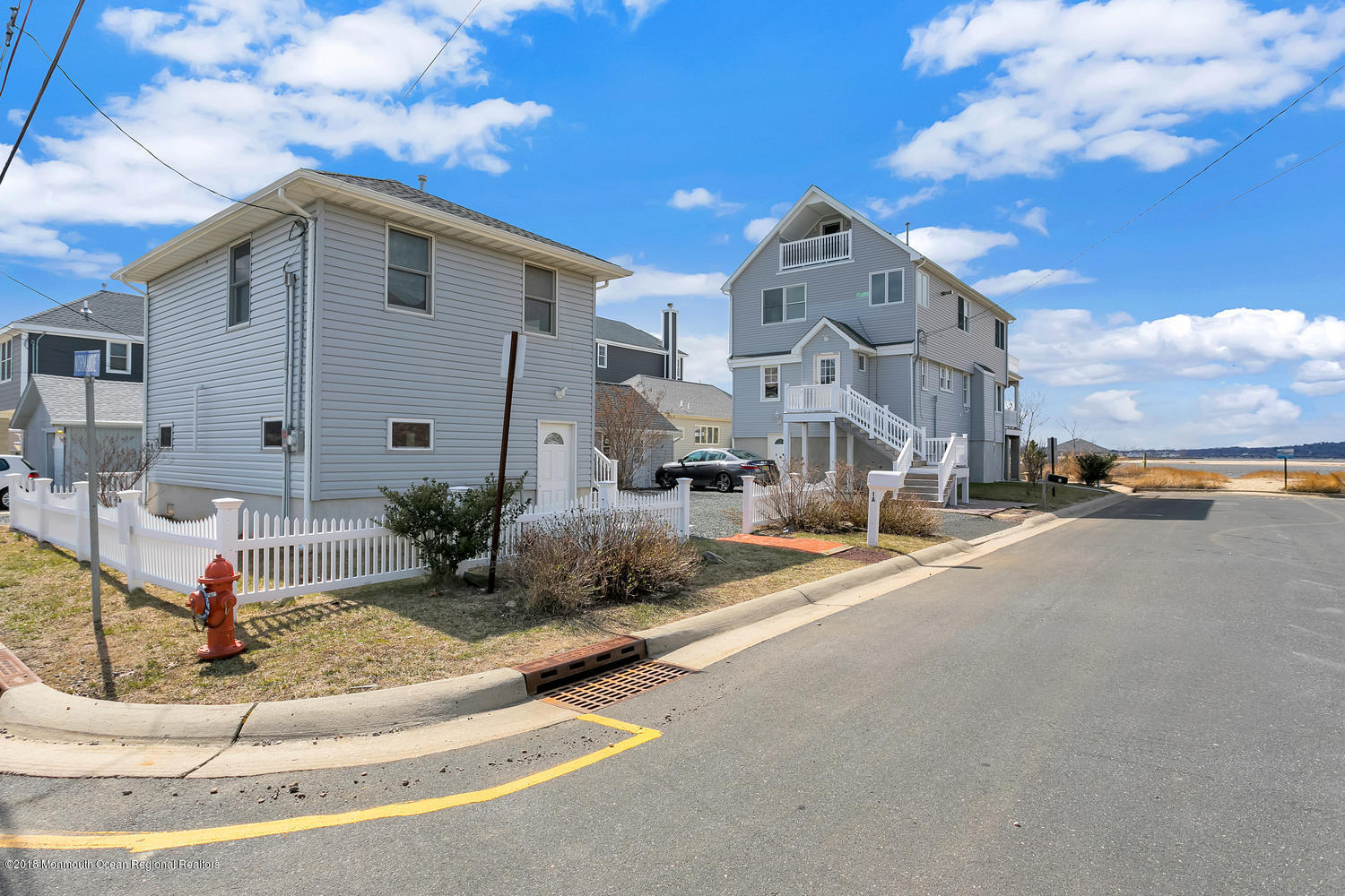 1 Beach Way, Unit A Sea Bright, NJ 07760 - Photo 3 of 15 a front view of a house with a yard