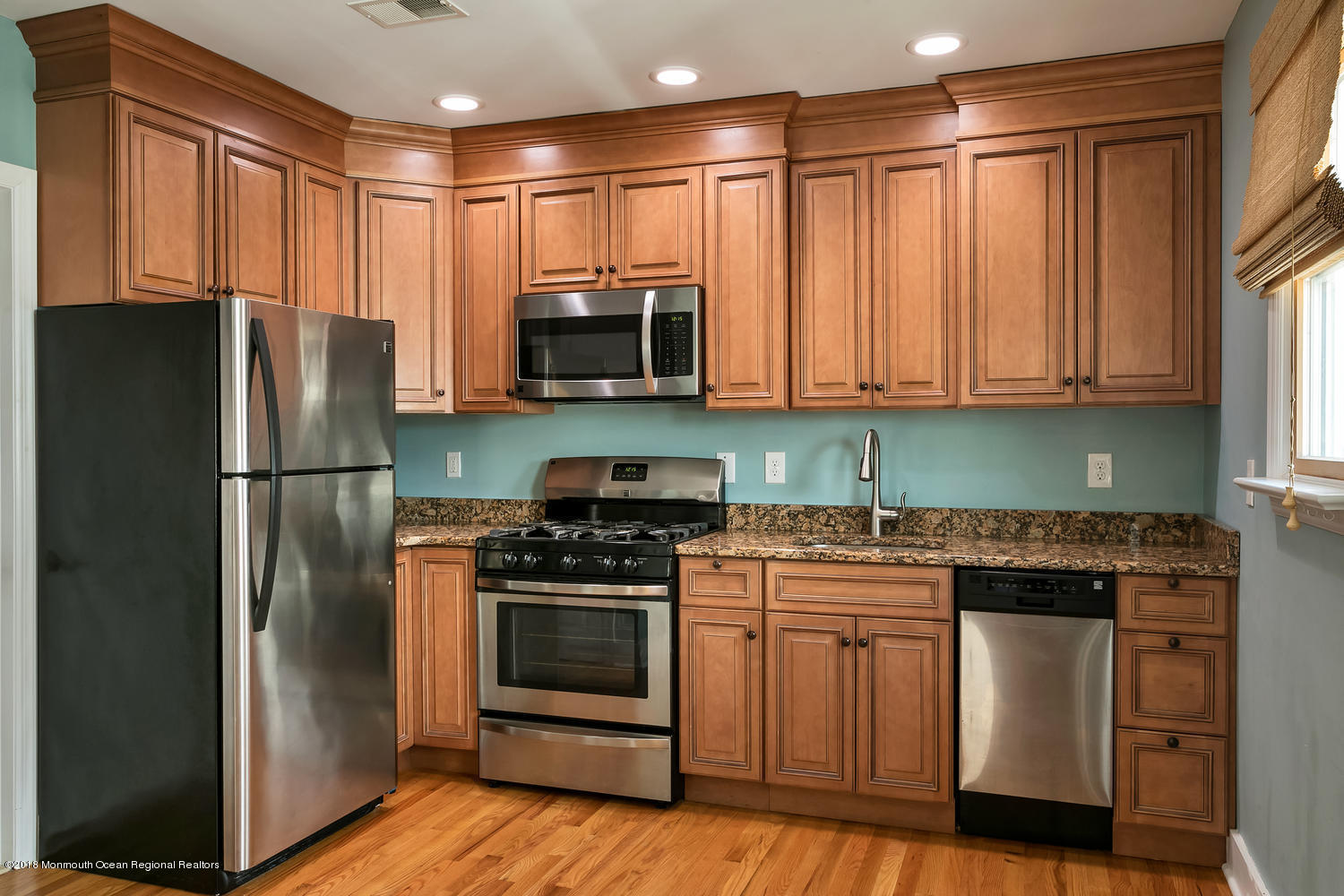 1 Beach Way, Unit A Sea Bright, NJ 07760 - Photo 4 of 15 a kitchen with a stove refrigerator and microwave