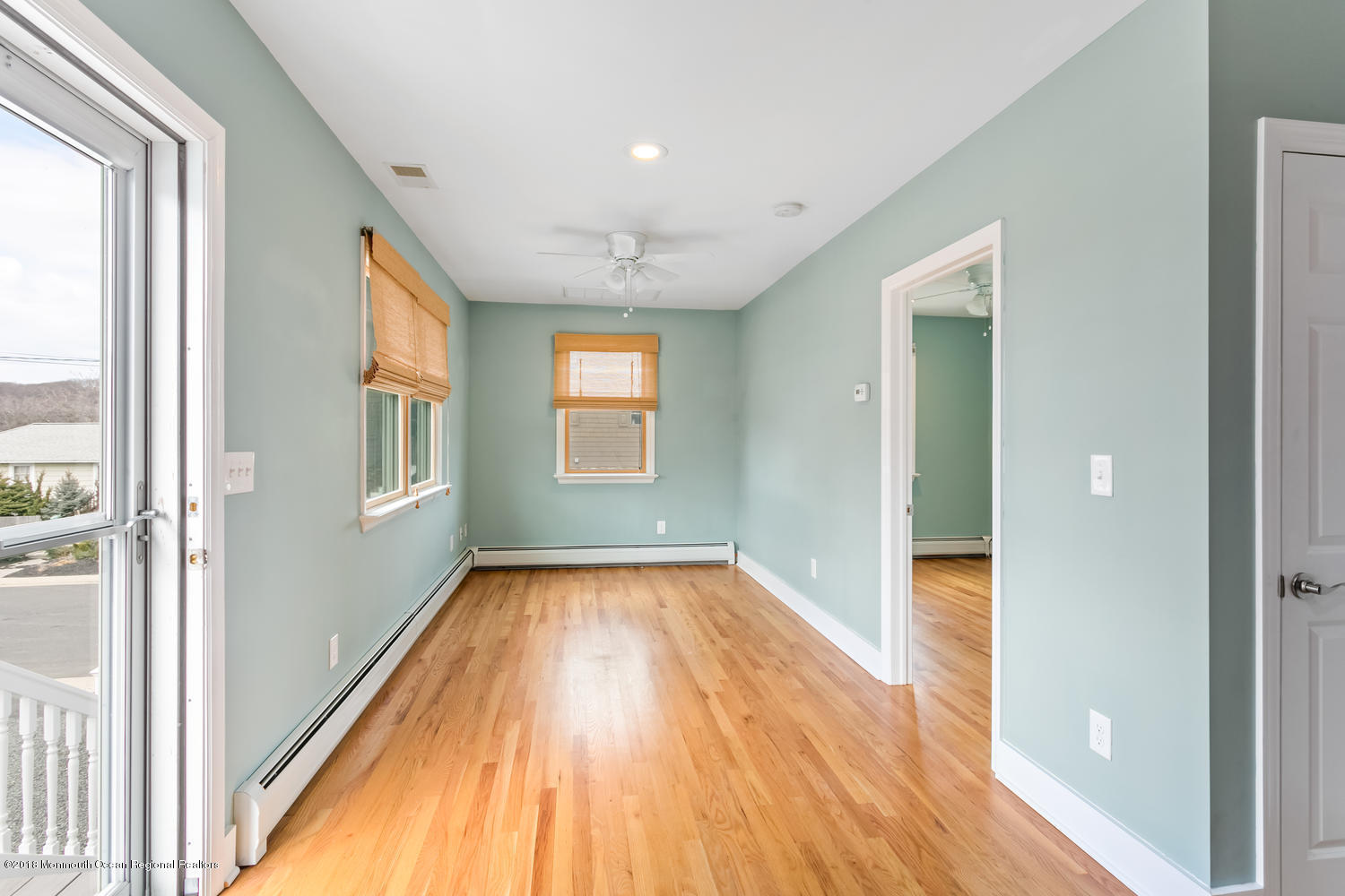 1 Beach Way, Unit A Sea Bright, NJ 07760 - Photo 7 of 15 a view of a hallway with wooden floor and windows